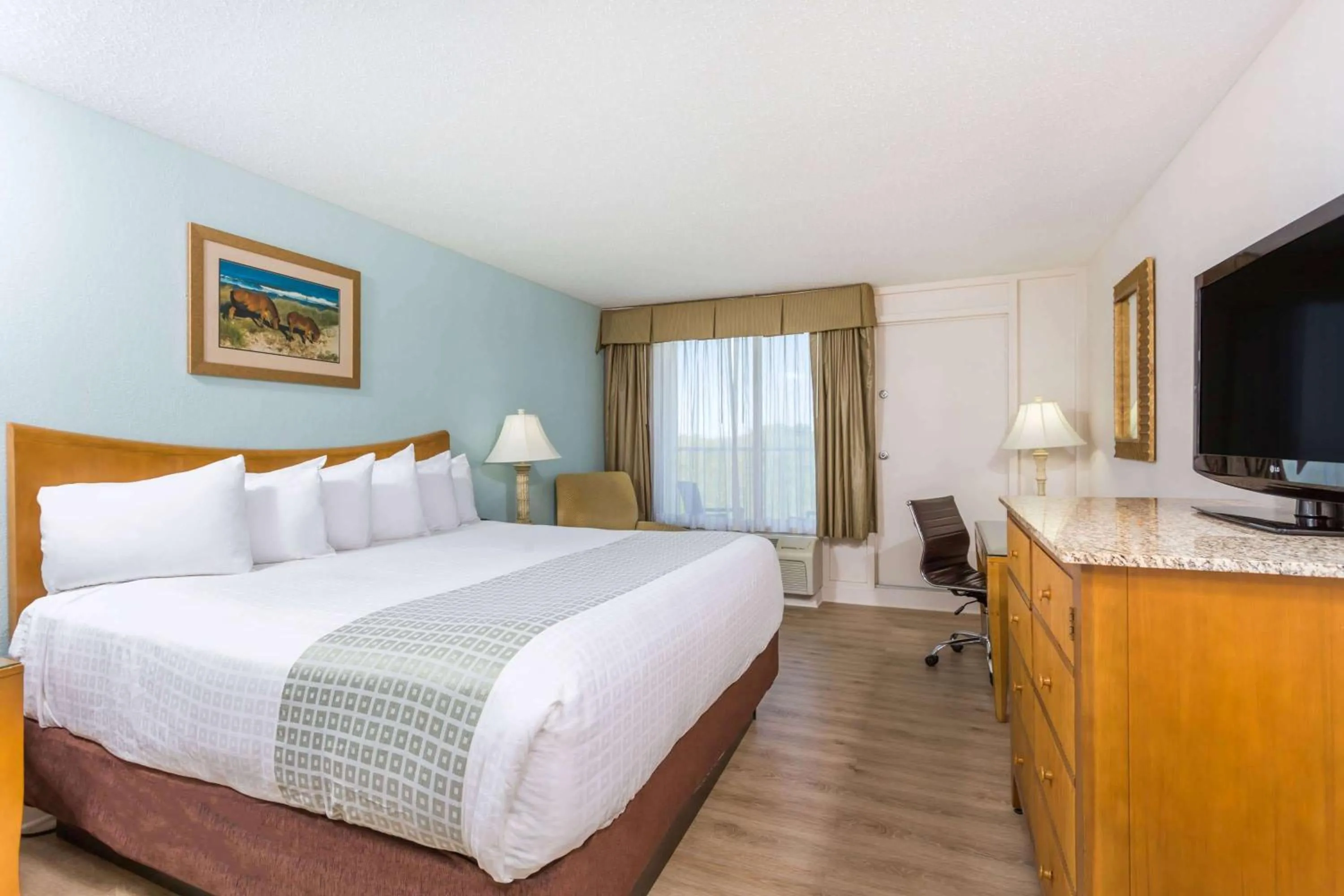 Photo of the whole room, Bed in Ramada Plaza by Wyndham Nags Head Oceanfront
