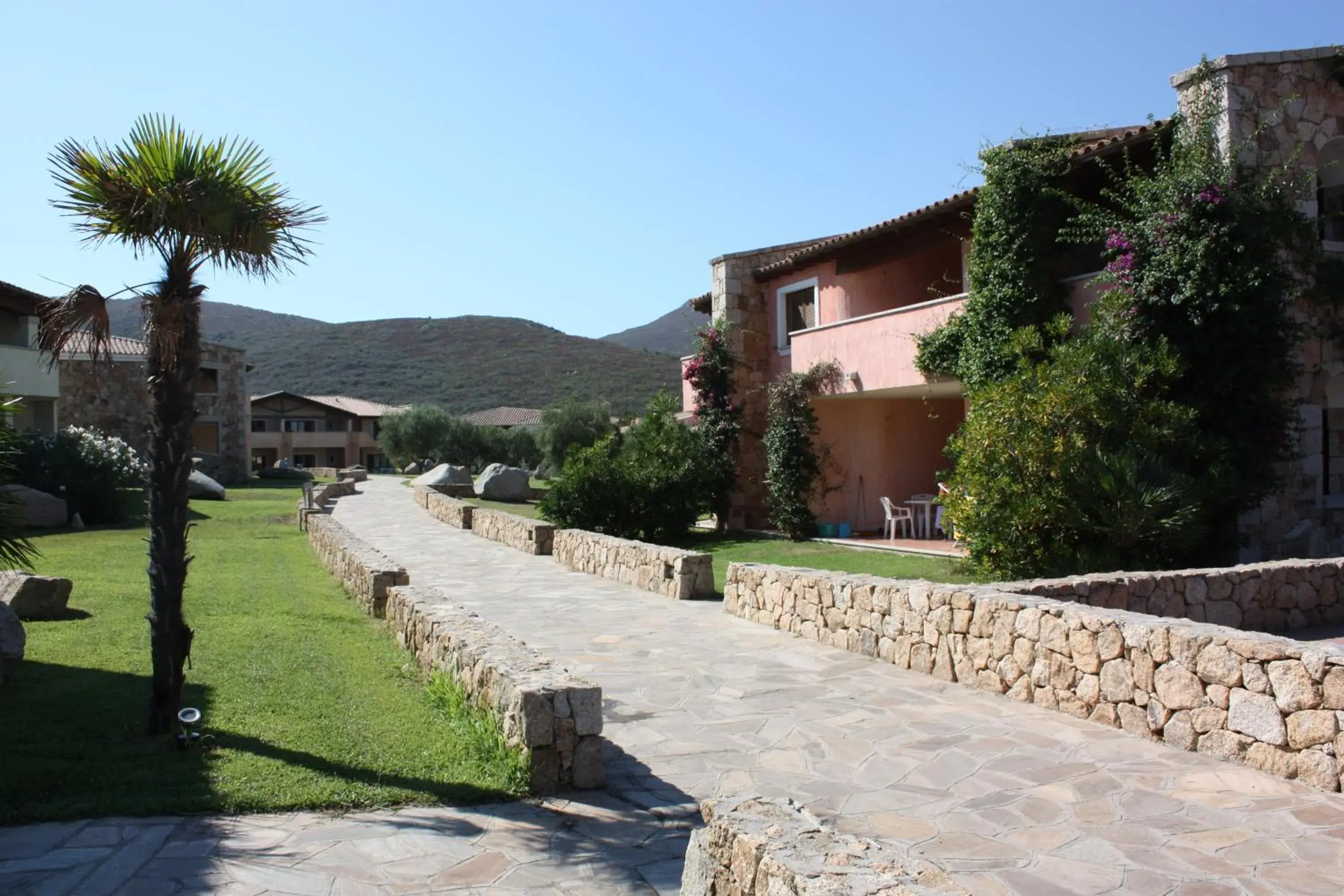 Property building in Le Corti di Marinella Property building in Le Corti di Marinella