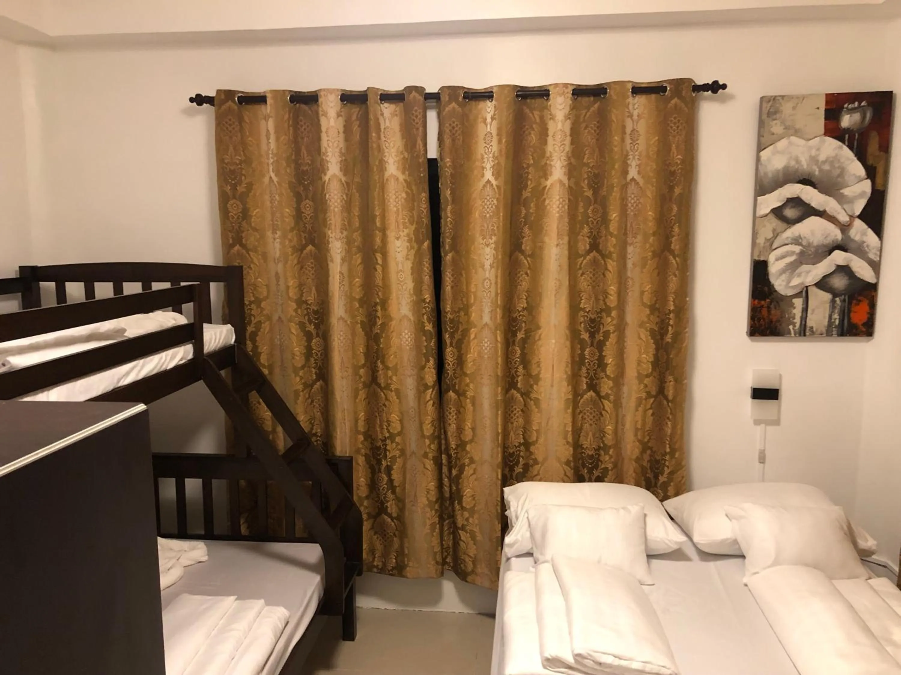 Bed in Cuestas Beach Resort and Restaurant