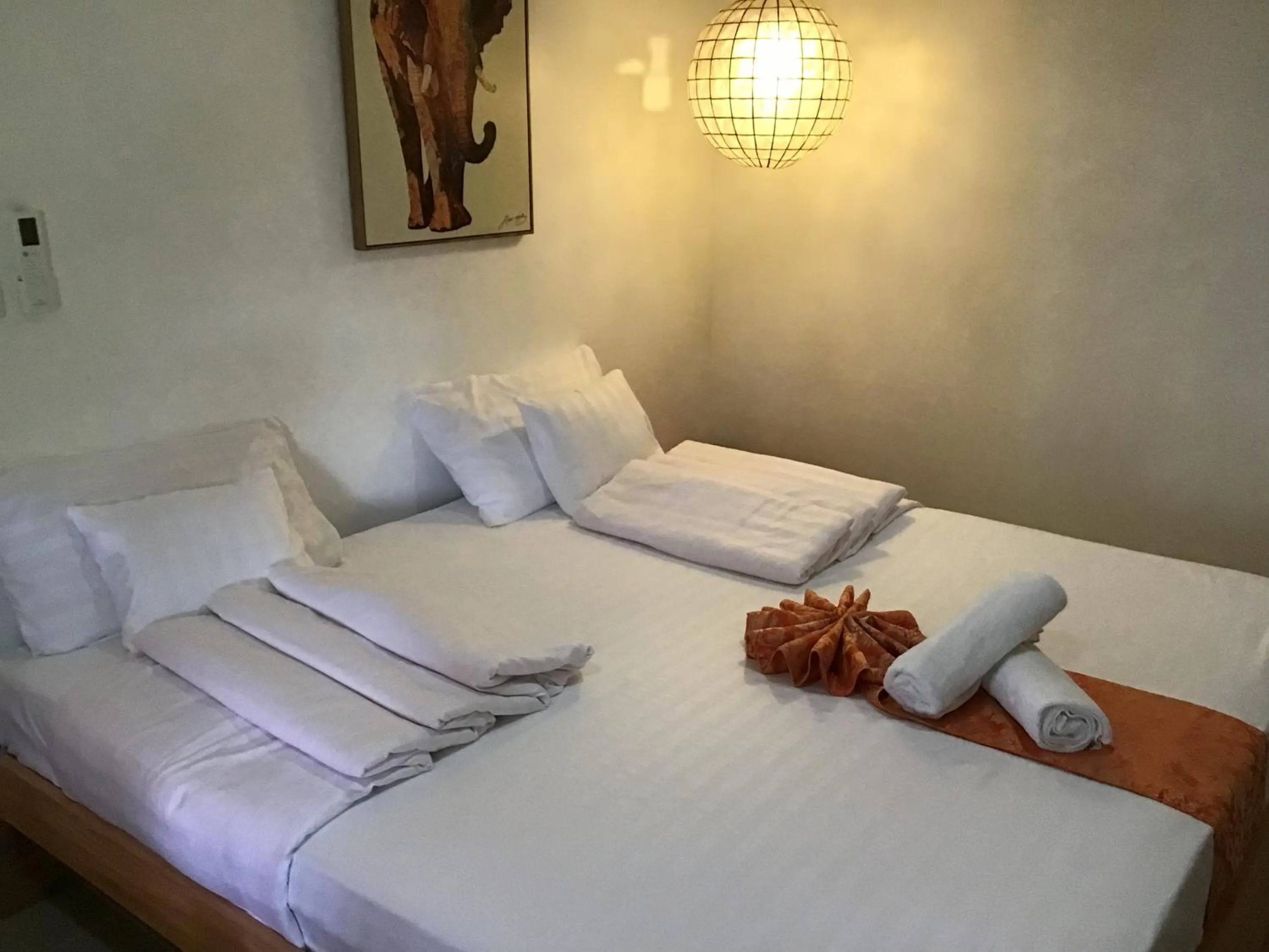 Bed in Cuestas Beach Resort and Restaurant