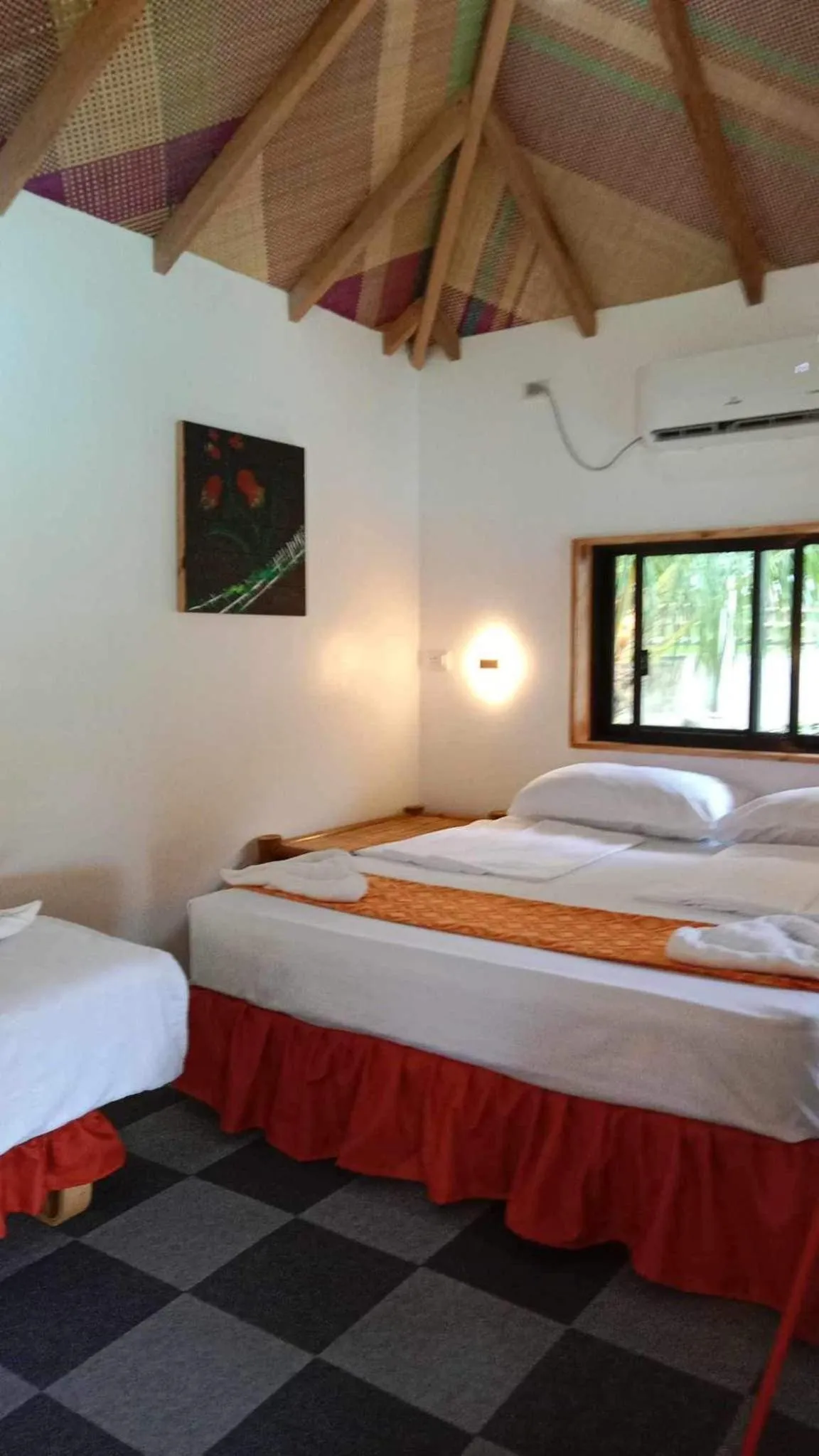 Photo of the whole room, Bed in Cuestas Beach Resort and Restaurant