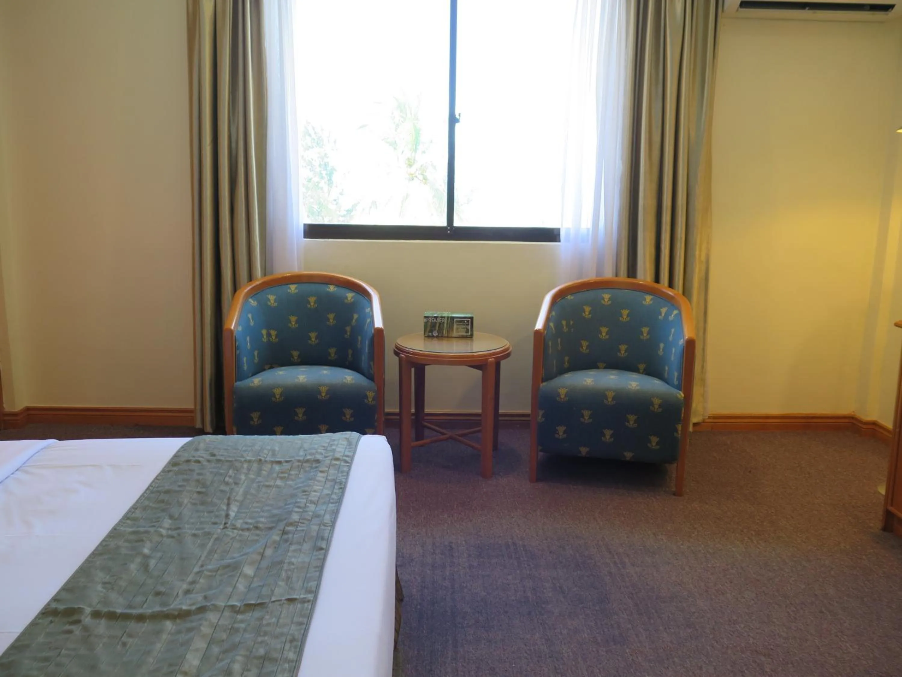 Seating area, Bed in Sea View Resort Hotel & Apartments