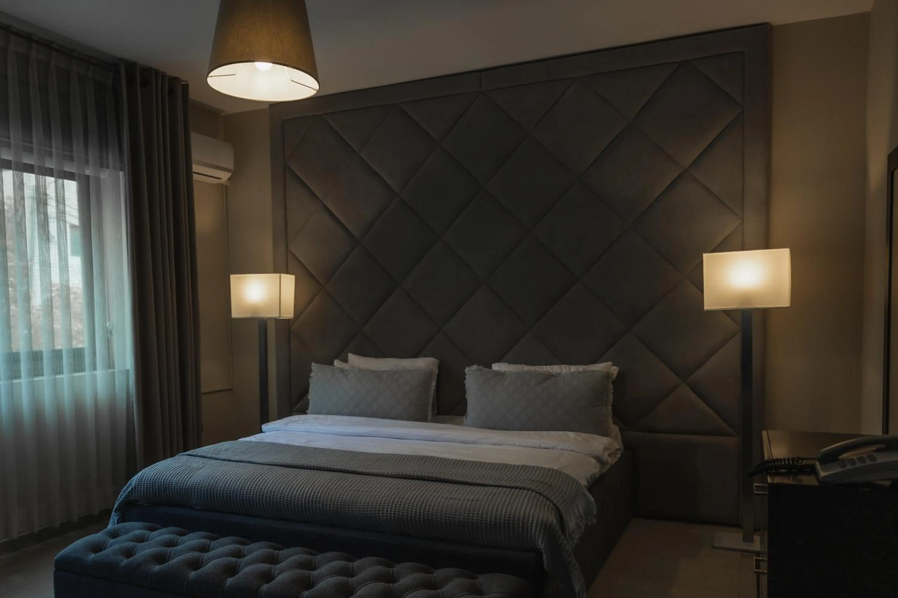 Bed in Ankars Suites & Hotel