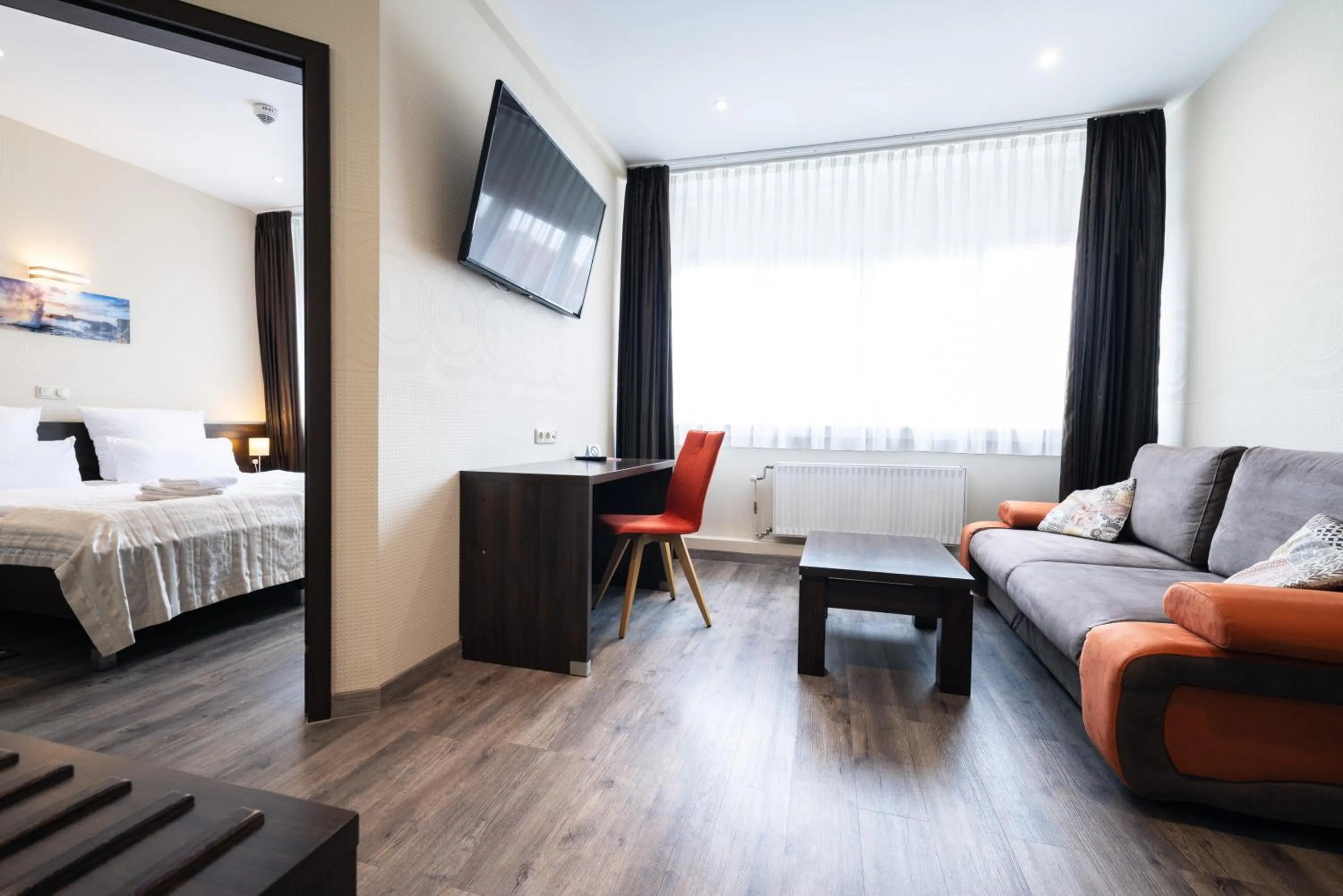 Living room, Bed in home Hotel