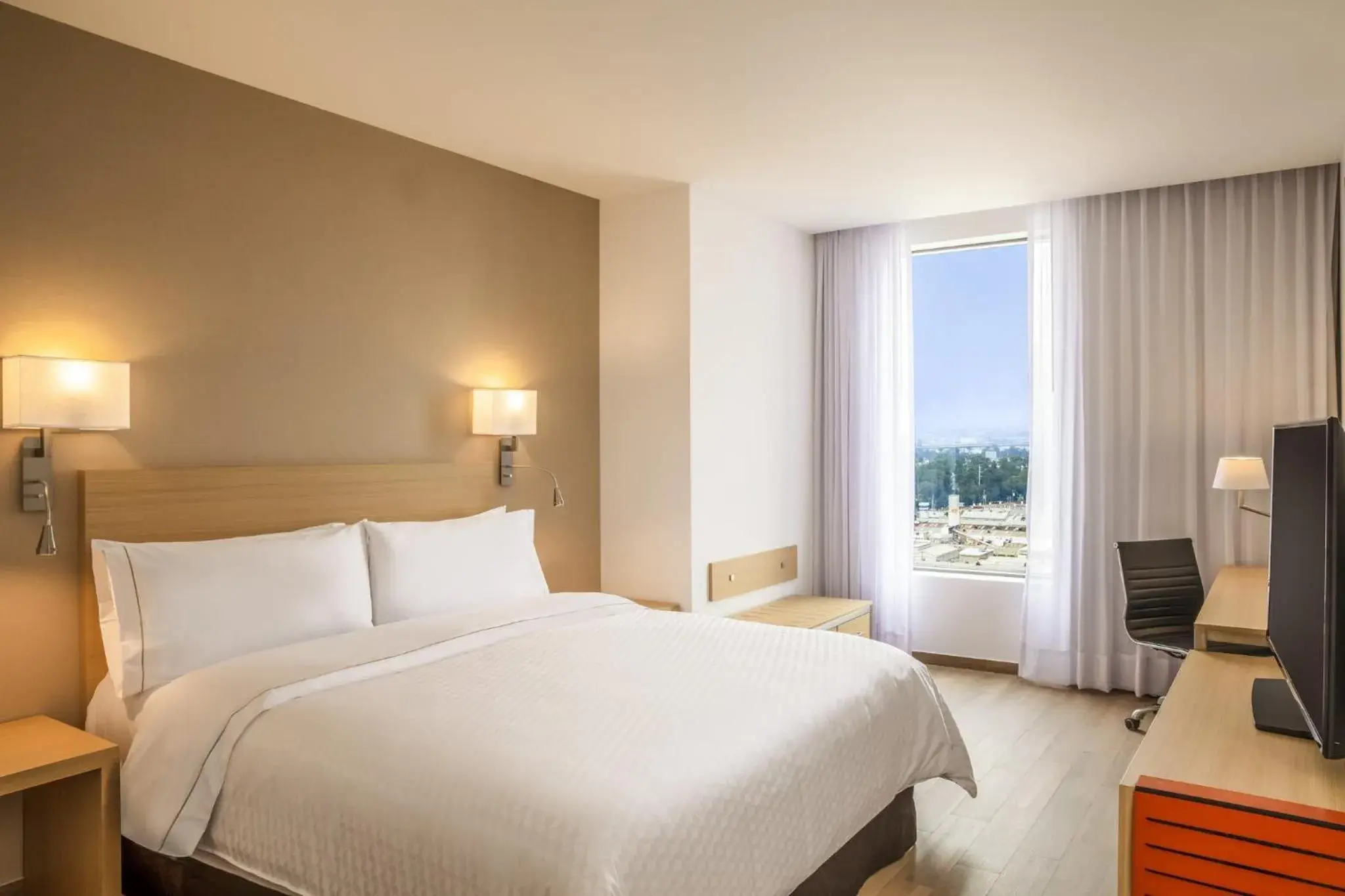 Photo of the whole room, Bed in Fiesta Inn Parque Puebla Photo of the whole room, Bed in Fiesta Inn Parque Puebla