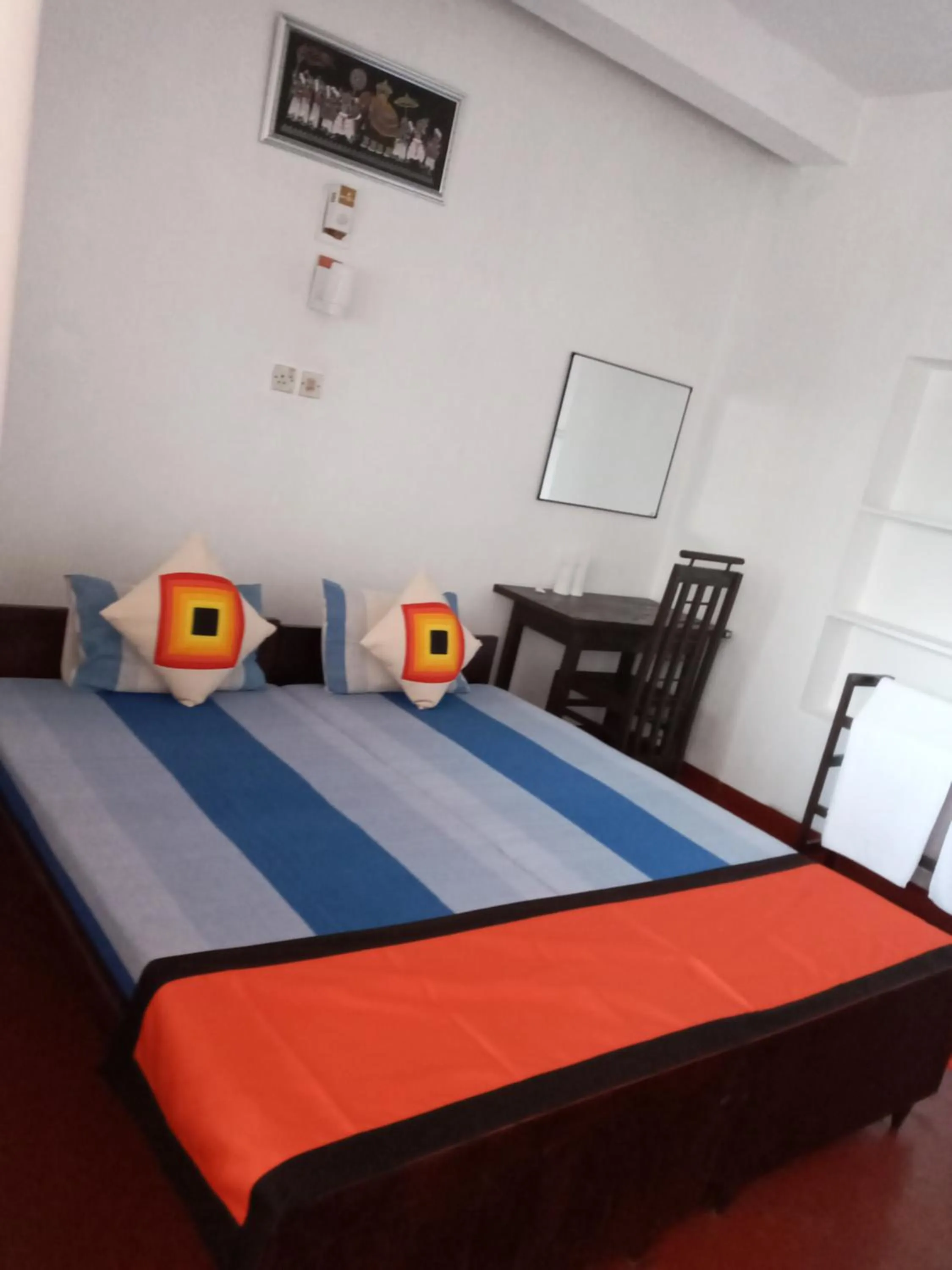 Bed in New SeaSide Inn Hikkaduwa