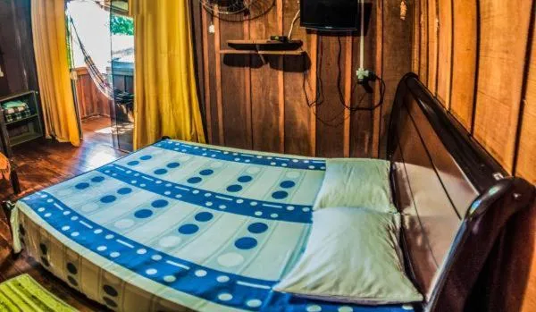 Bed in Pousada Recanto Tropical