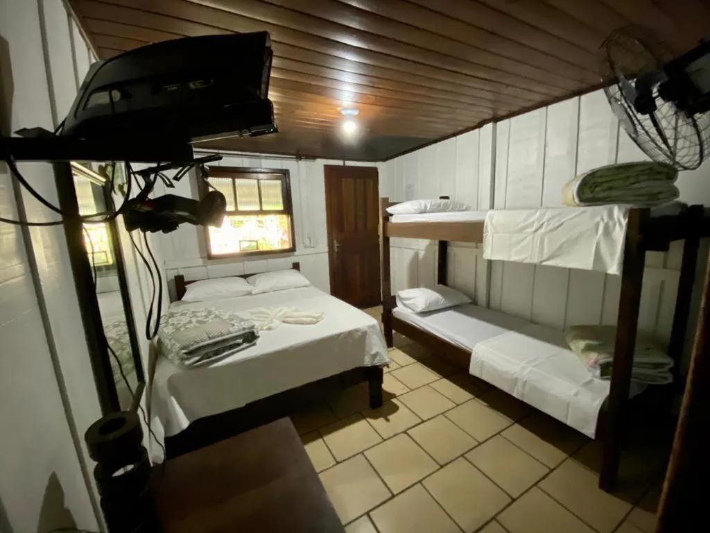 Bed in Pousada Recanto Tropical
