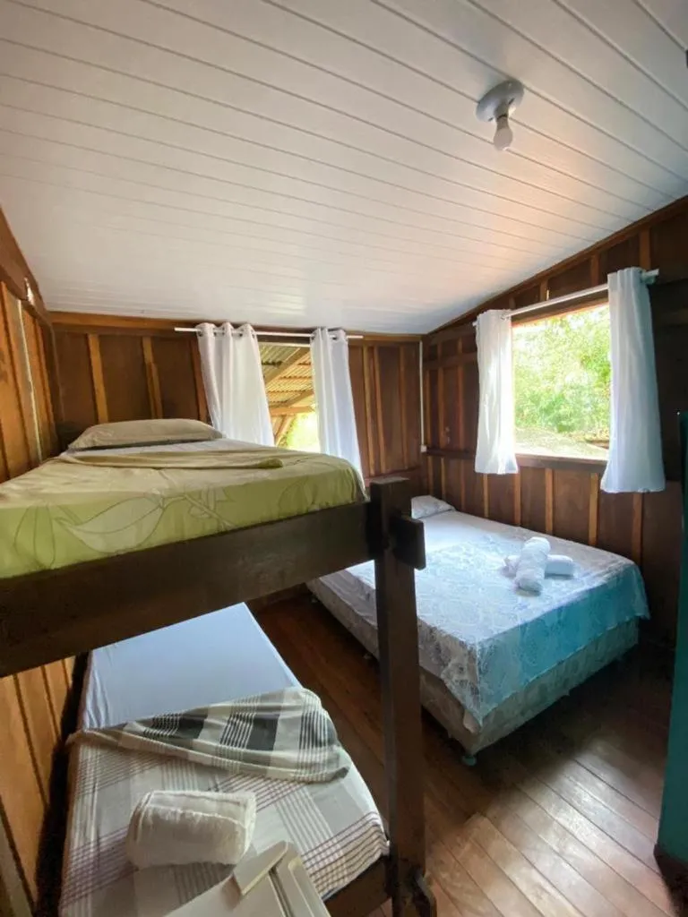 Bed in Pousada Recanto Tropical