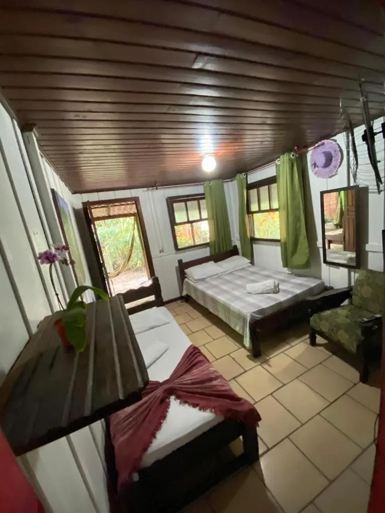 Bed in Pousada Recanto Tropical