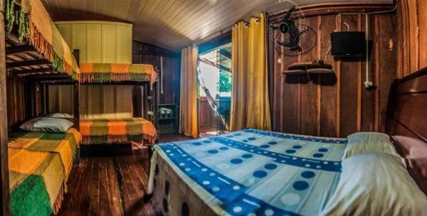 Bed in Pousada Recanto Tropical
