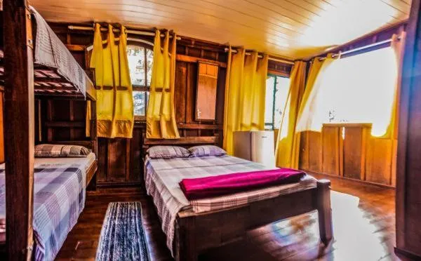 Bed in Pousada Recanto Tropical