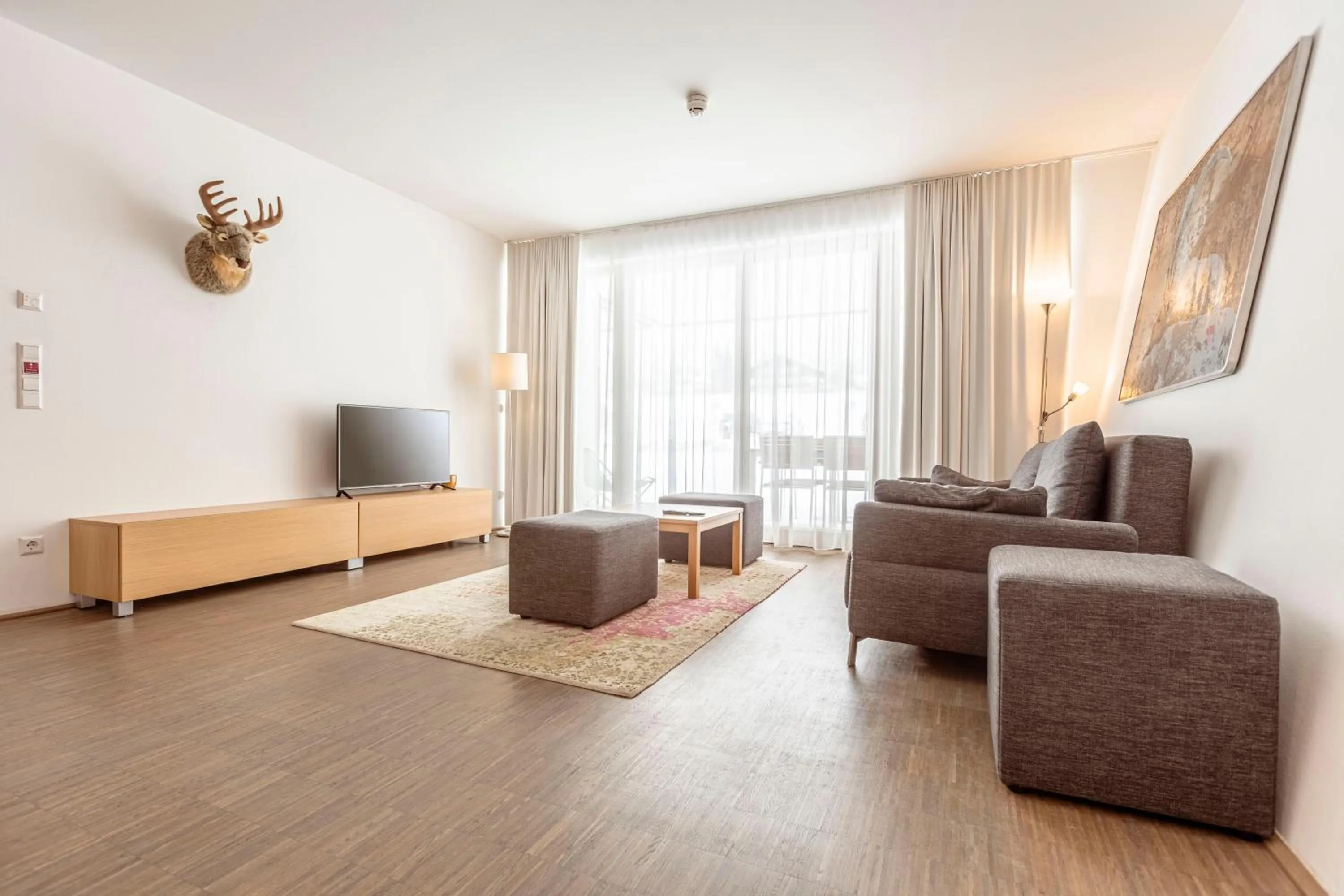 Communal lounge/ TV room in Alpenrock Schladming by ALPS RESORTS