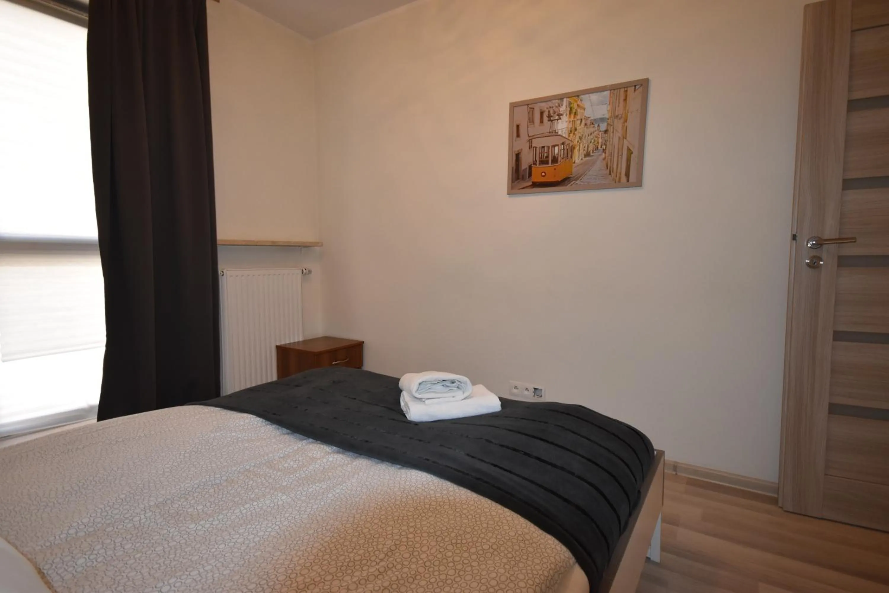 Bed in NotaBene Wola Apartment