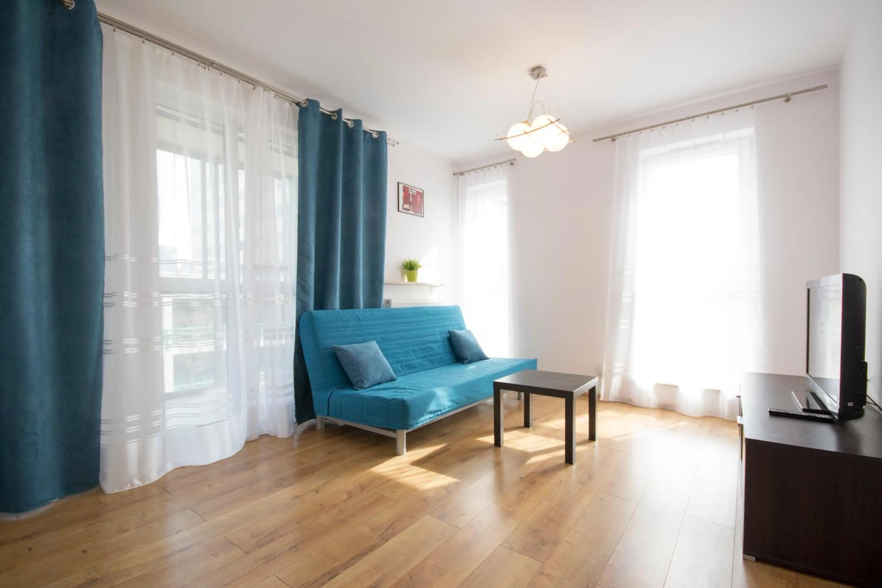 Living room in NotaBene Wola Apartment