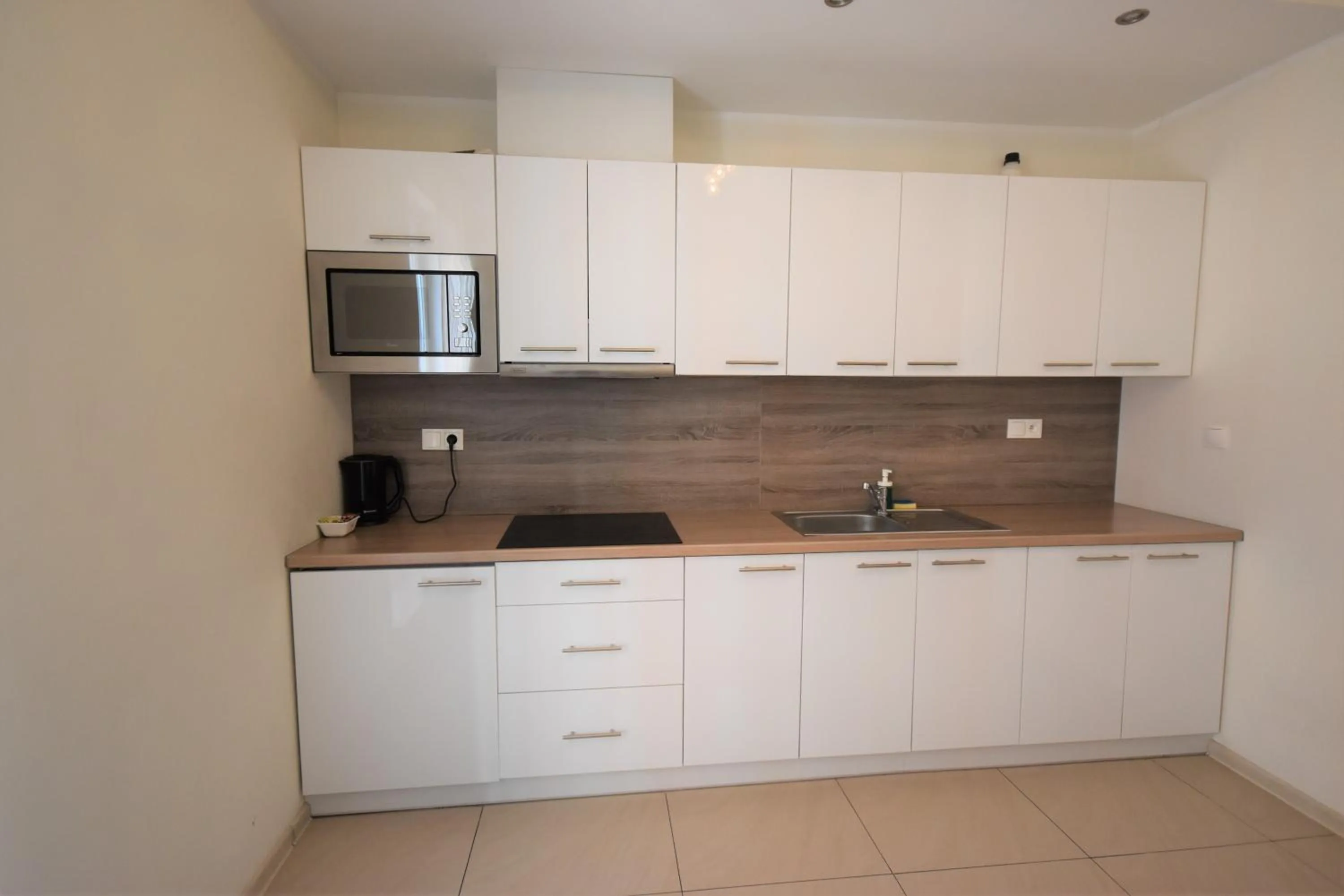 Kitchen or kitchenette in NotaBene Wola Apartment