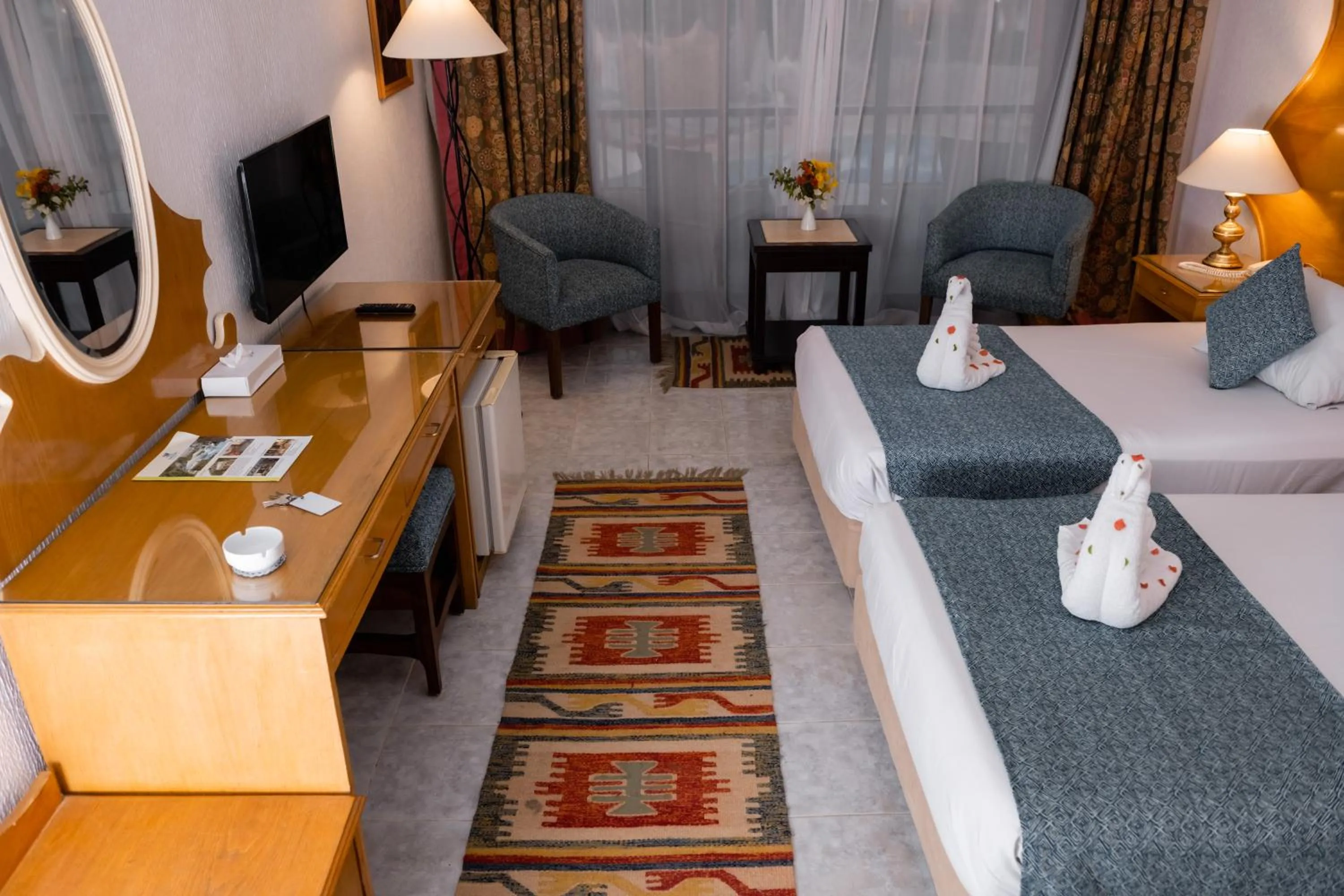 Communal lounge/ TV room, Bed in Turquoise Beach Hotel