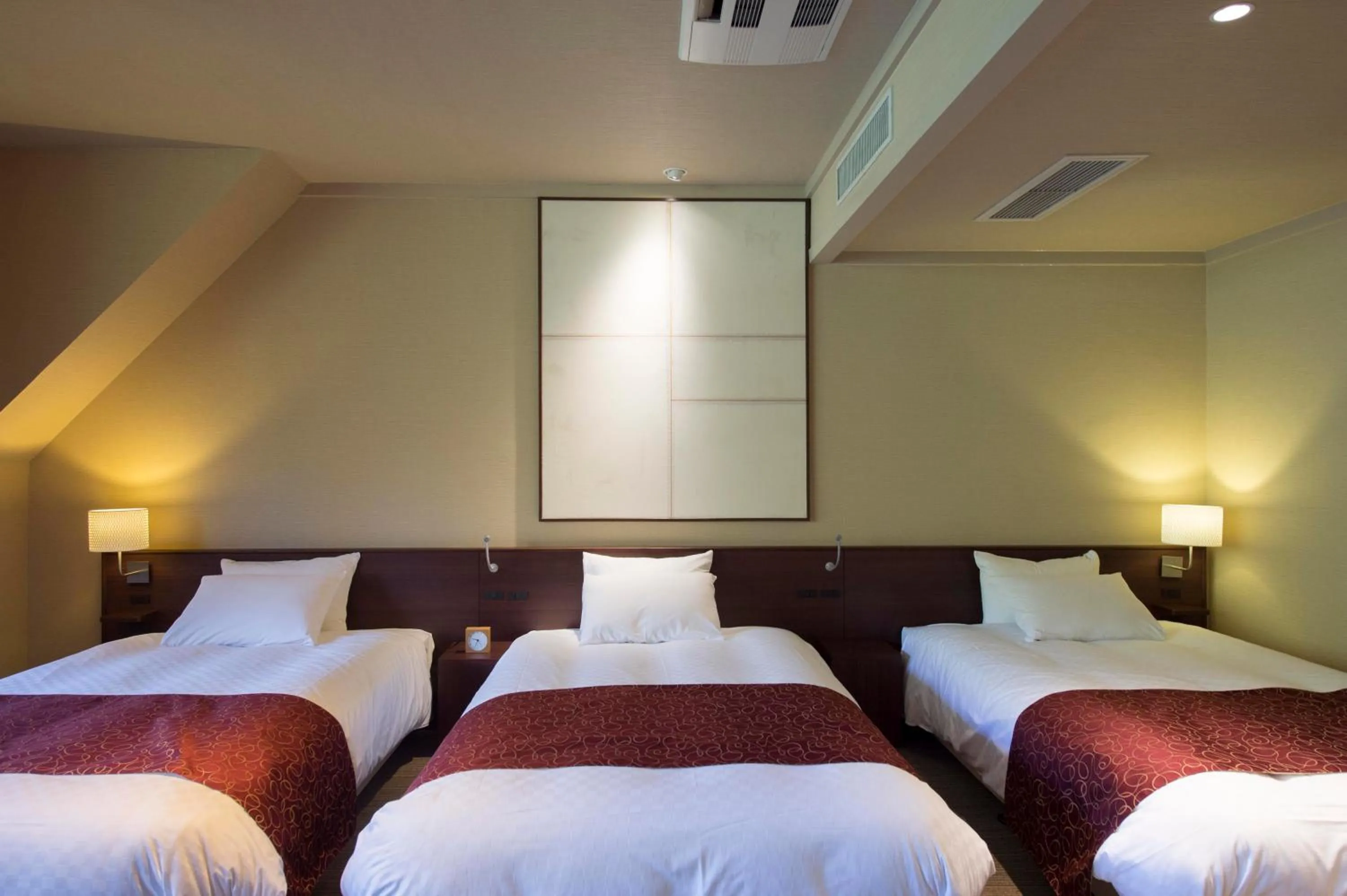 Bed in Takayama Wan Wan Paradise Hotel & Cottage