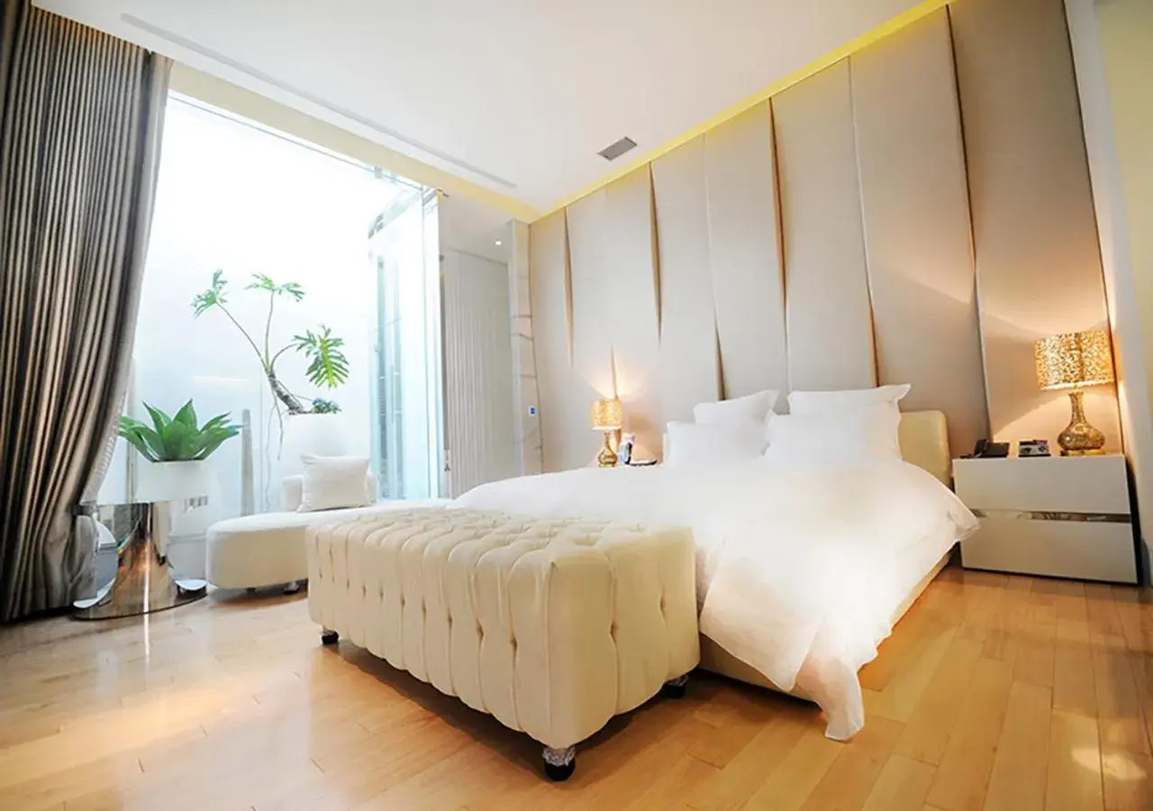 Bed in Royal Group Motel Ming Zu Branch Bed in Royal Group Motel Ming Zu Branch