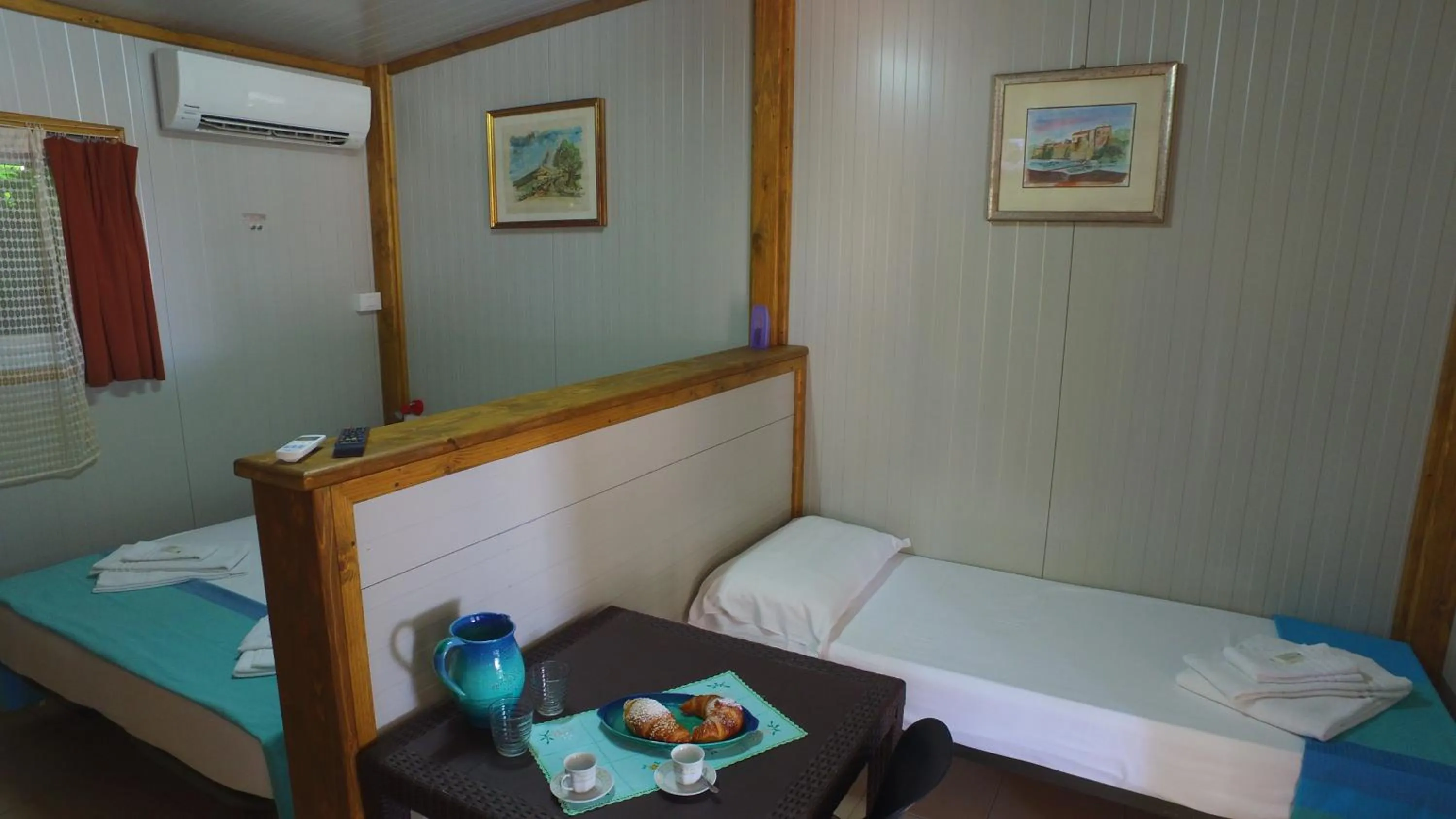 Living room, Bed in Camping Jonio