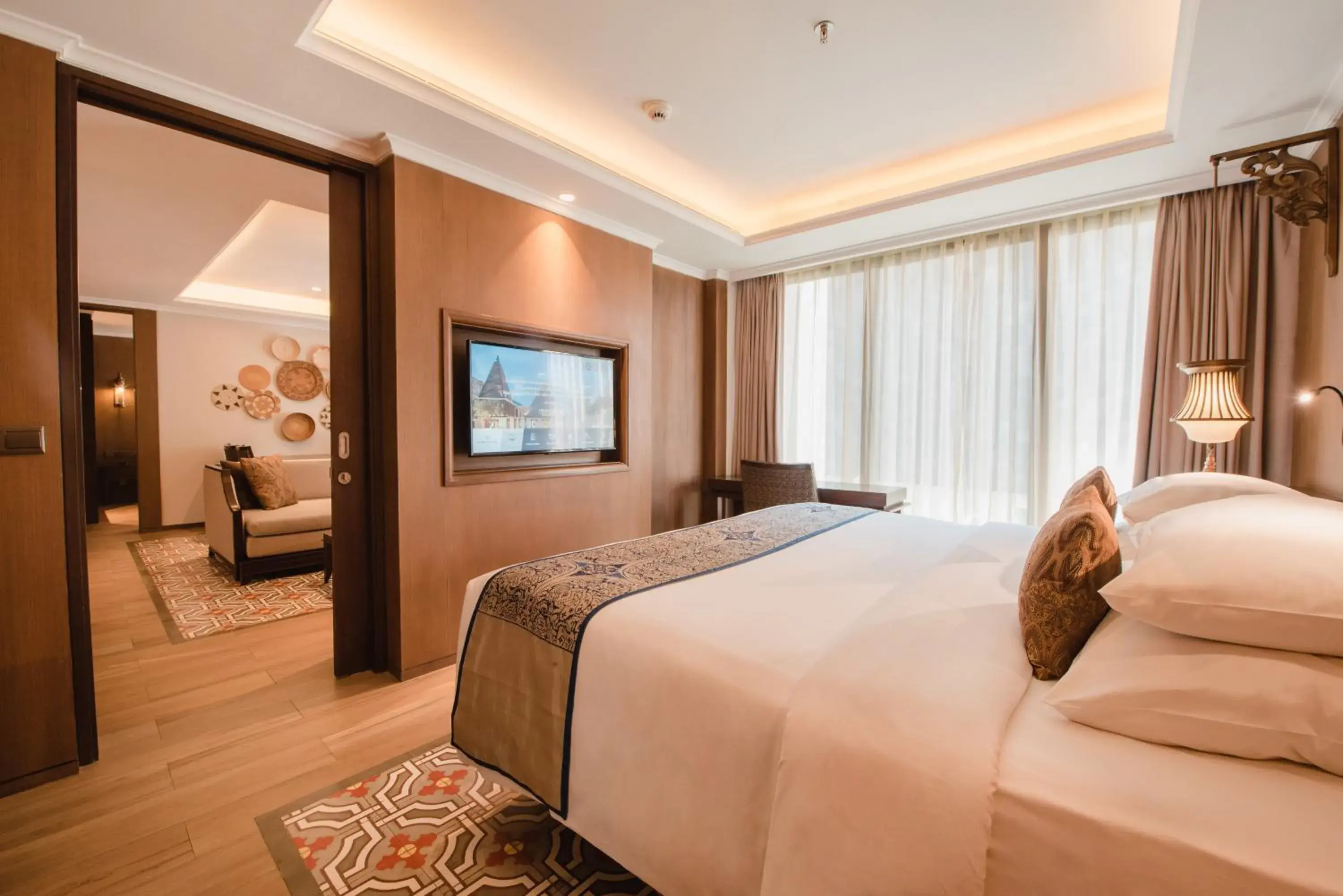 Bed in Ramayana Suites and Resort