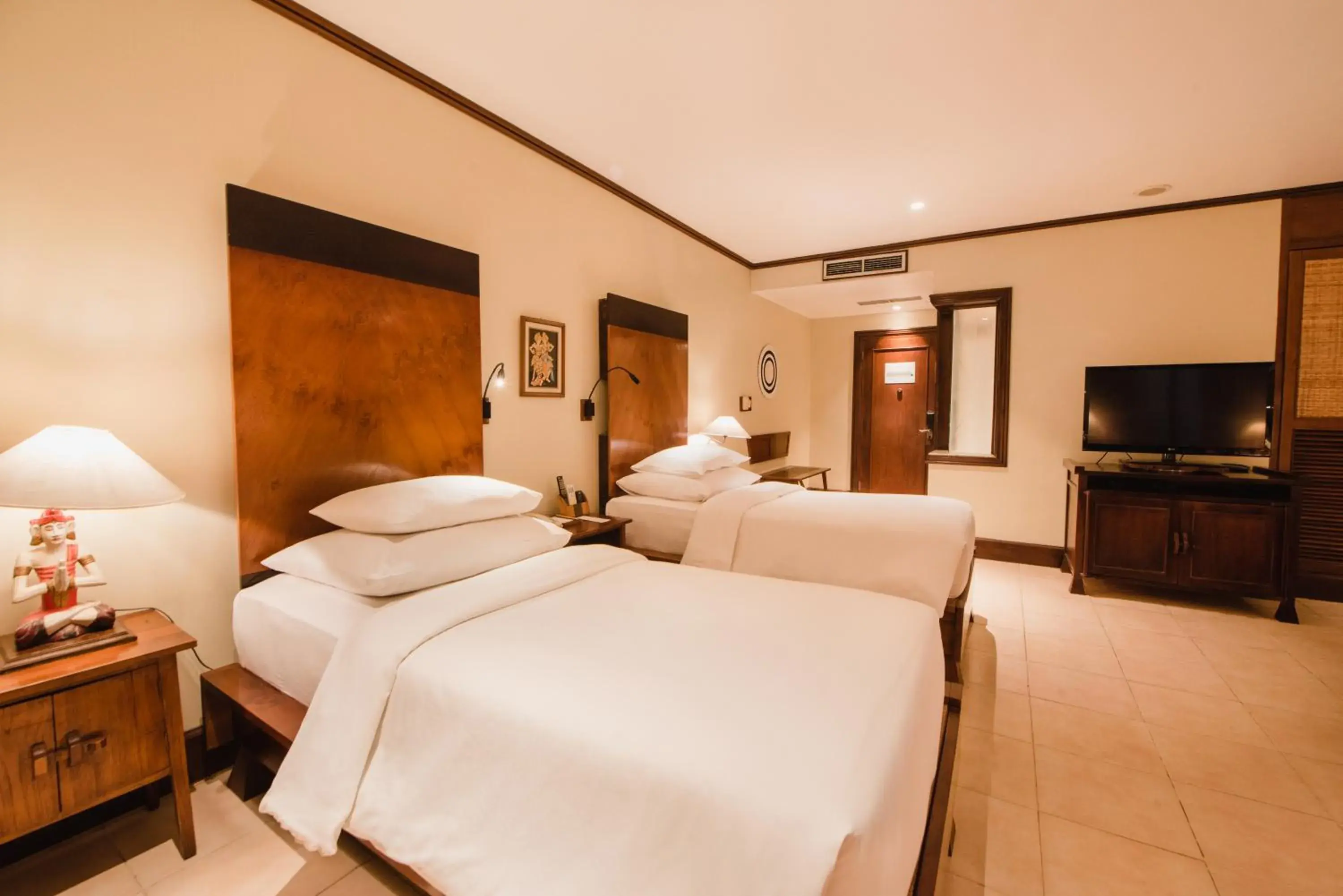 Bed in Ramayana Suites and Resort