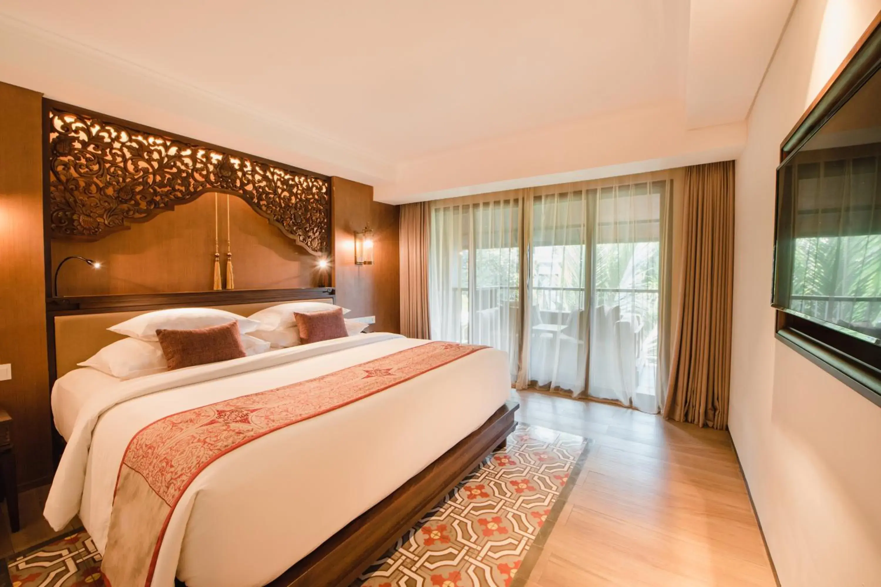 Bed in Ramayana Suites and Resort