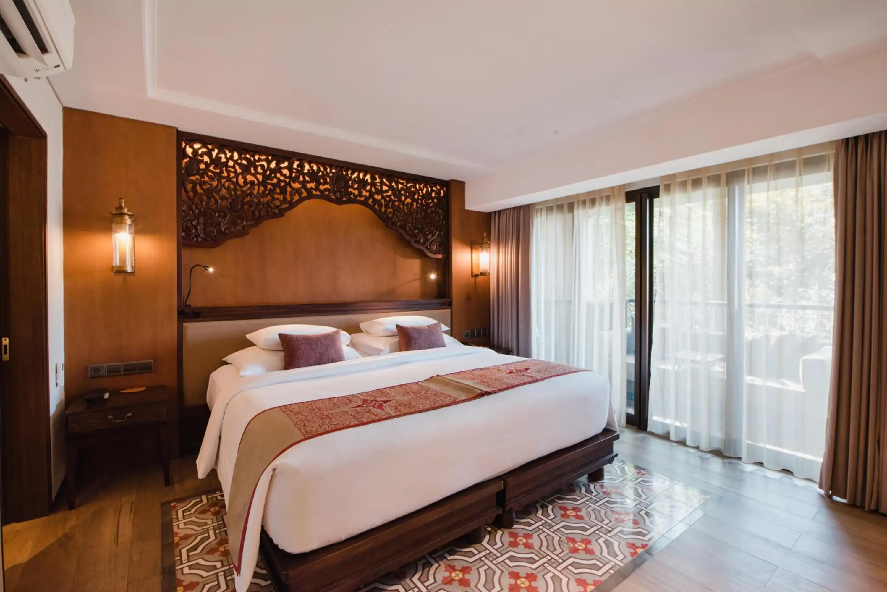 Bed in Ramayana Suites and Resort