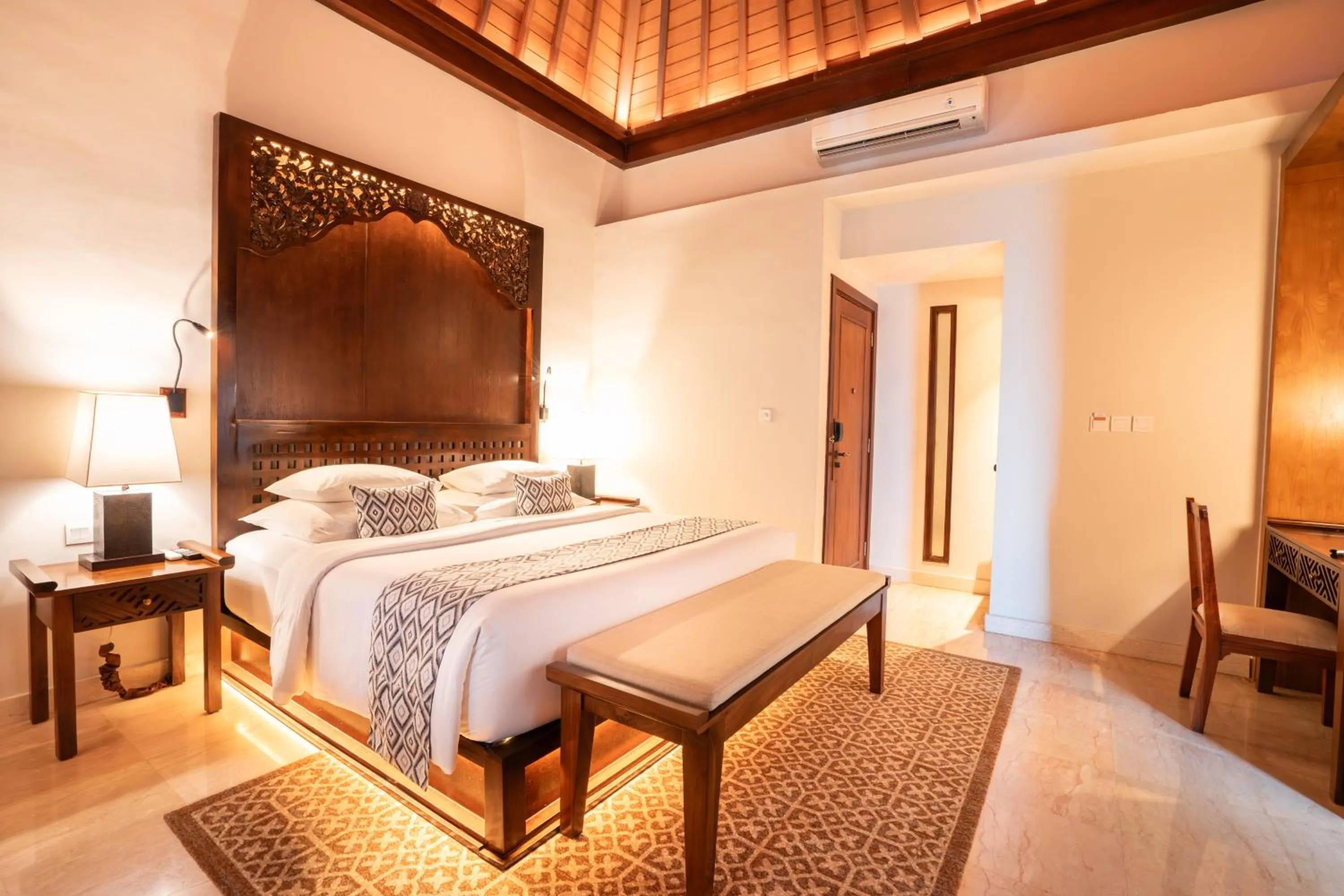 Bed in Ramayana Suites and Resort