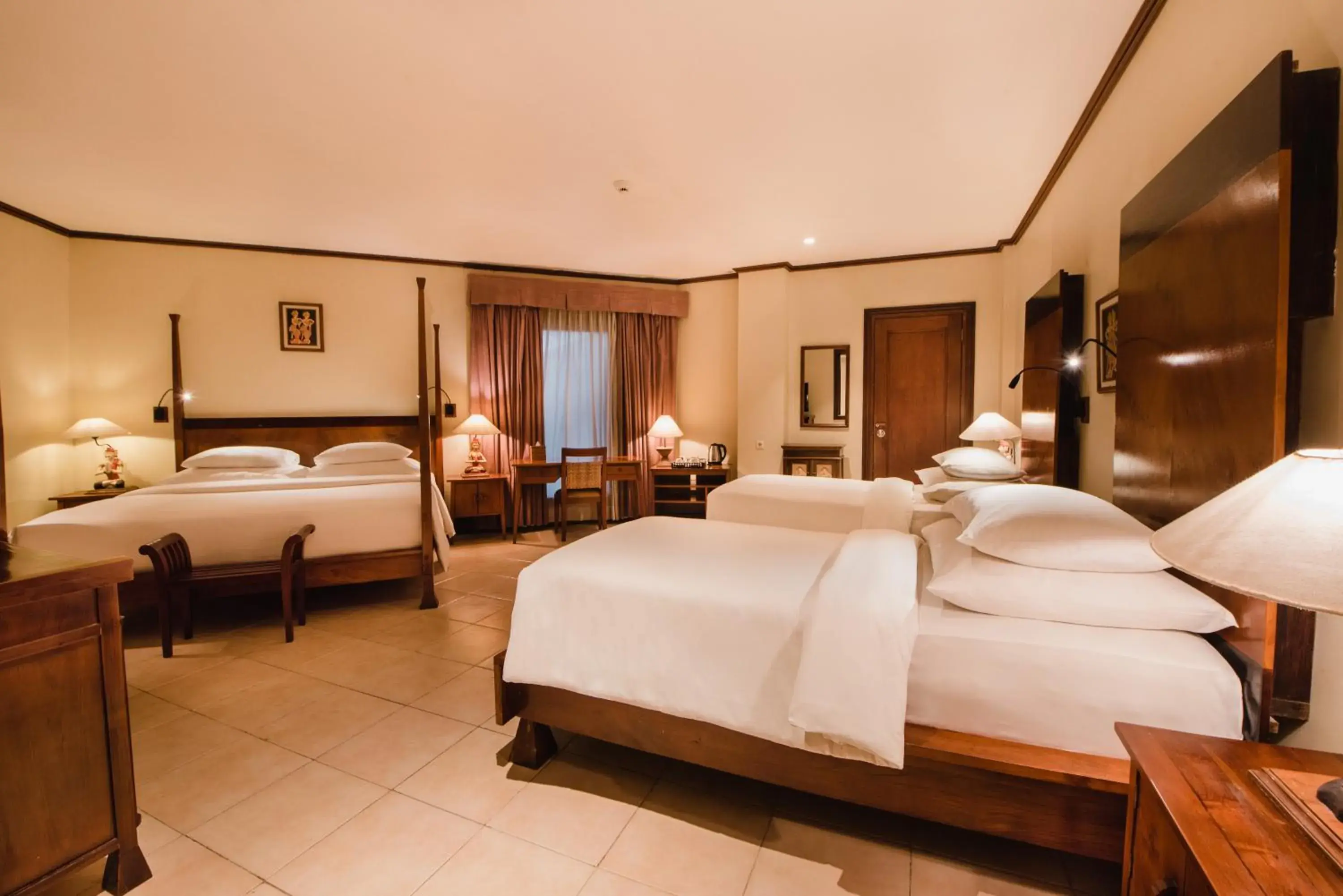 Bed in Ramayana Suites and Resort