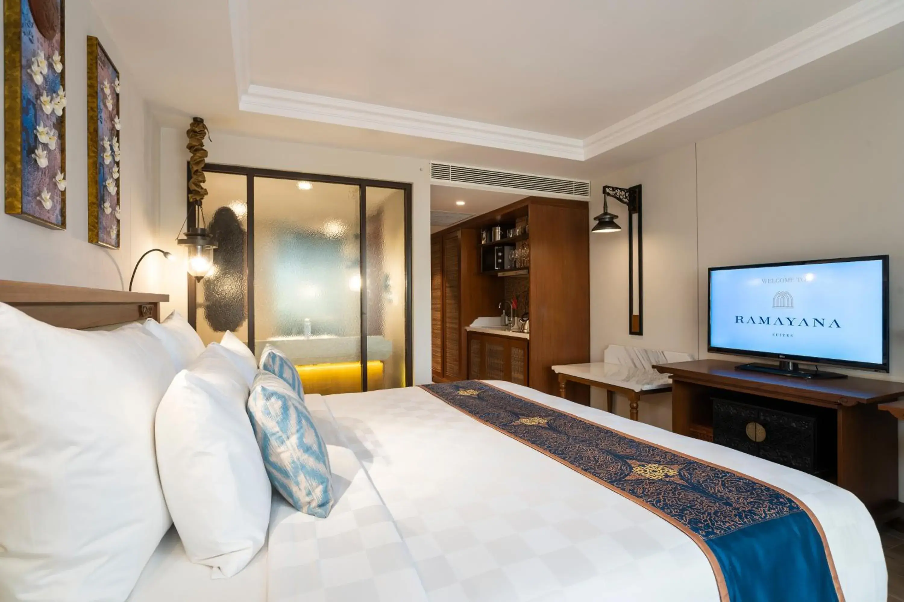 Bed, TV/Entertainment Center in Ramayana Suites and Resort
