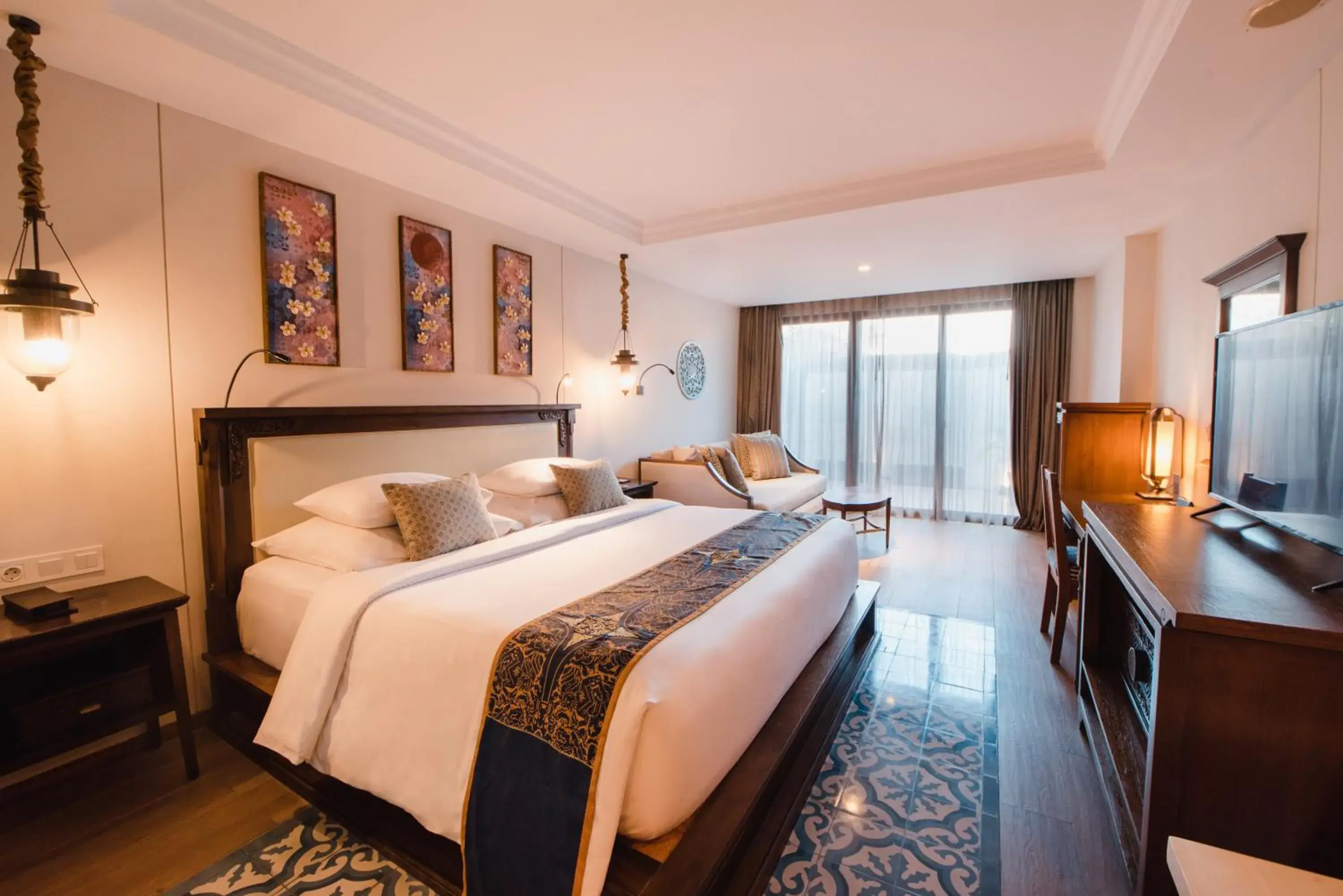 Bed in Ramayana Suites and Resort