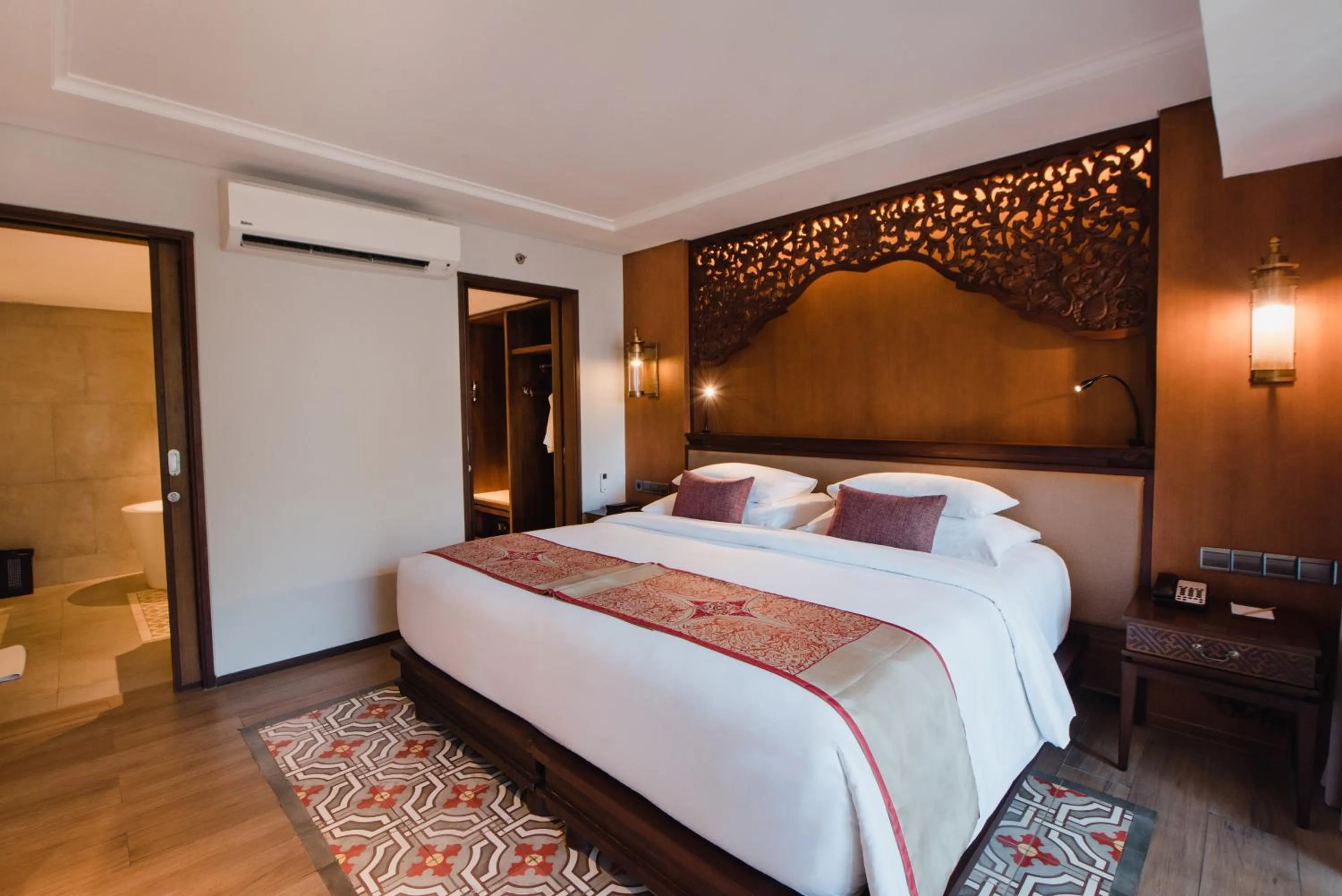 Bed in Ramayana Suites and Resort