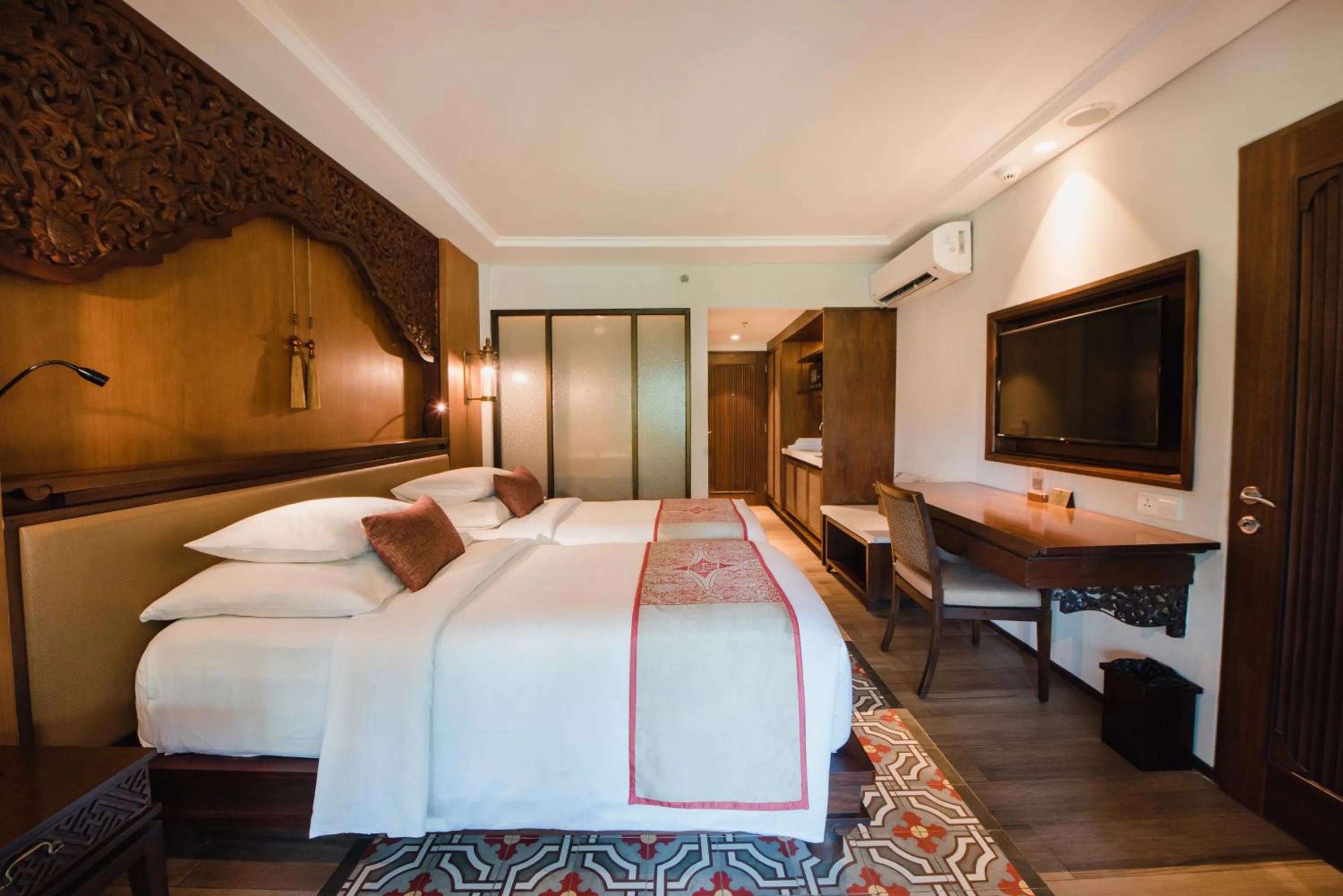 Bed in Ramayana Suites and Resort