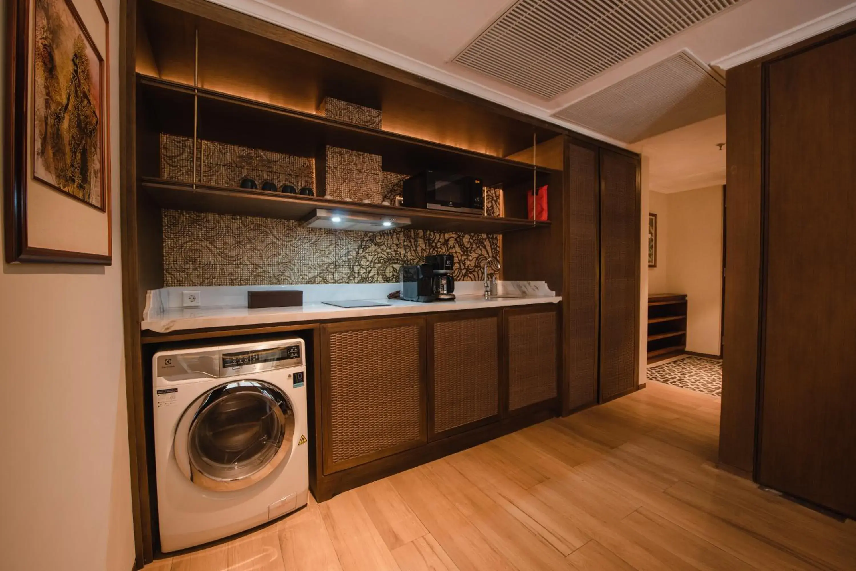 washing machine, Kitchen/Kitchenette in Ramayana Suites and Resort