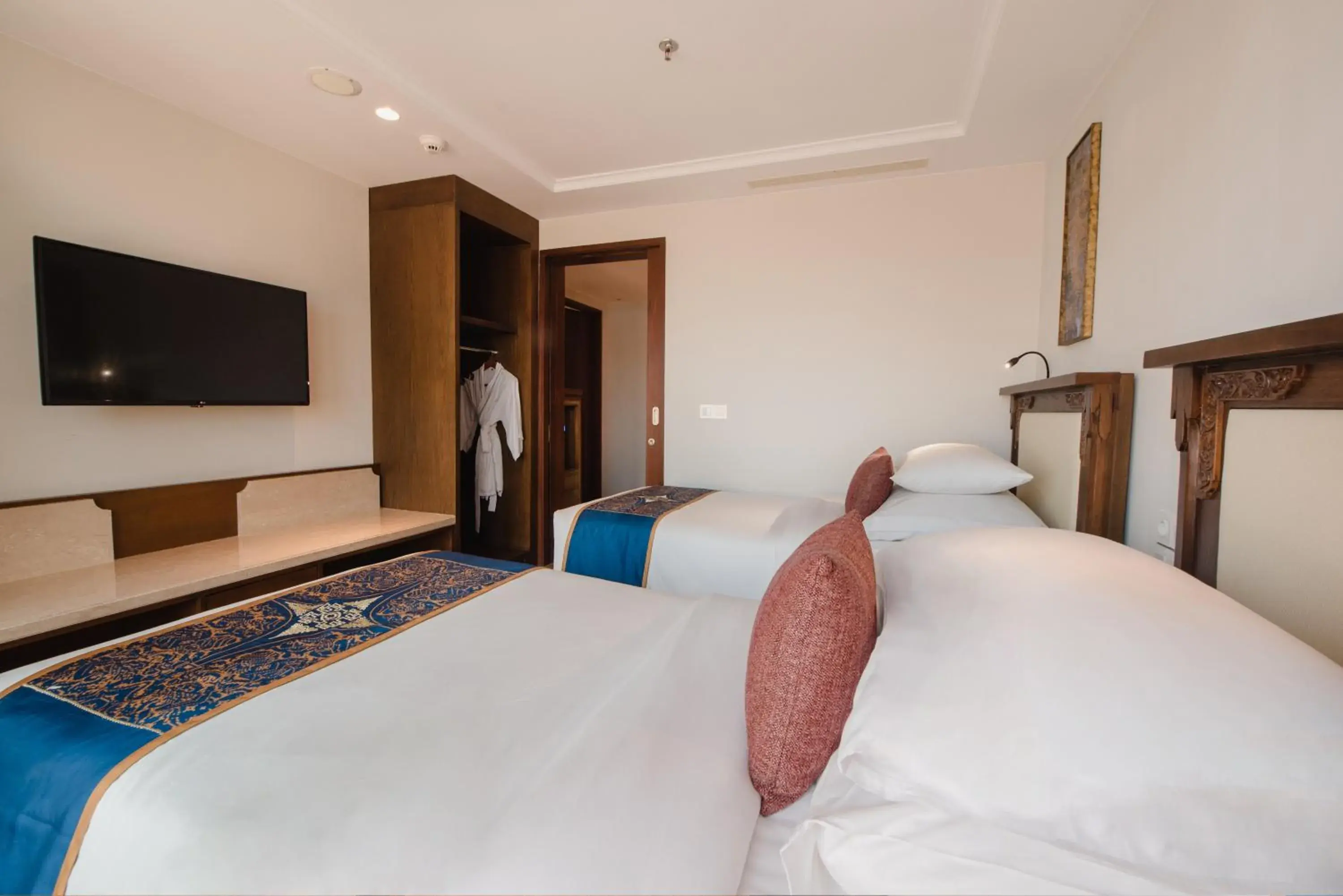 Bed in Ramayana Suites and Resort