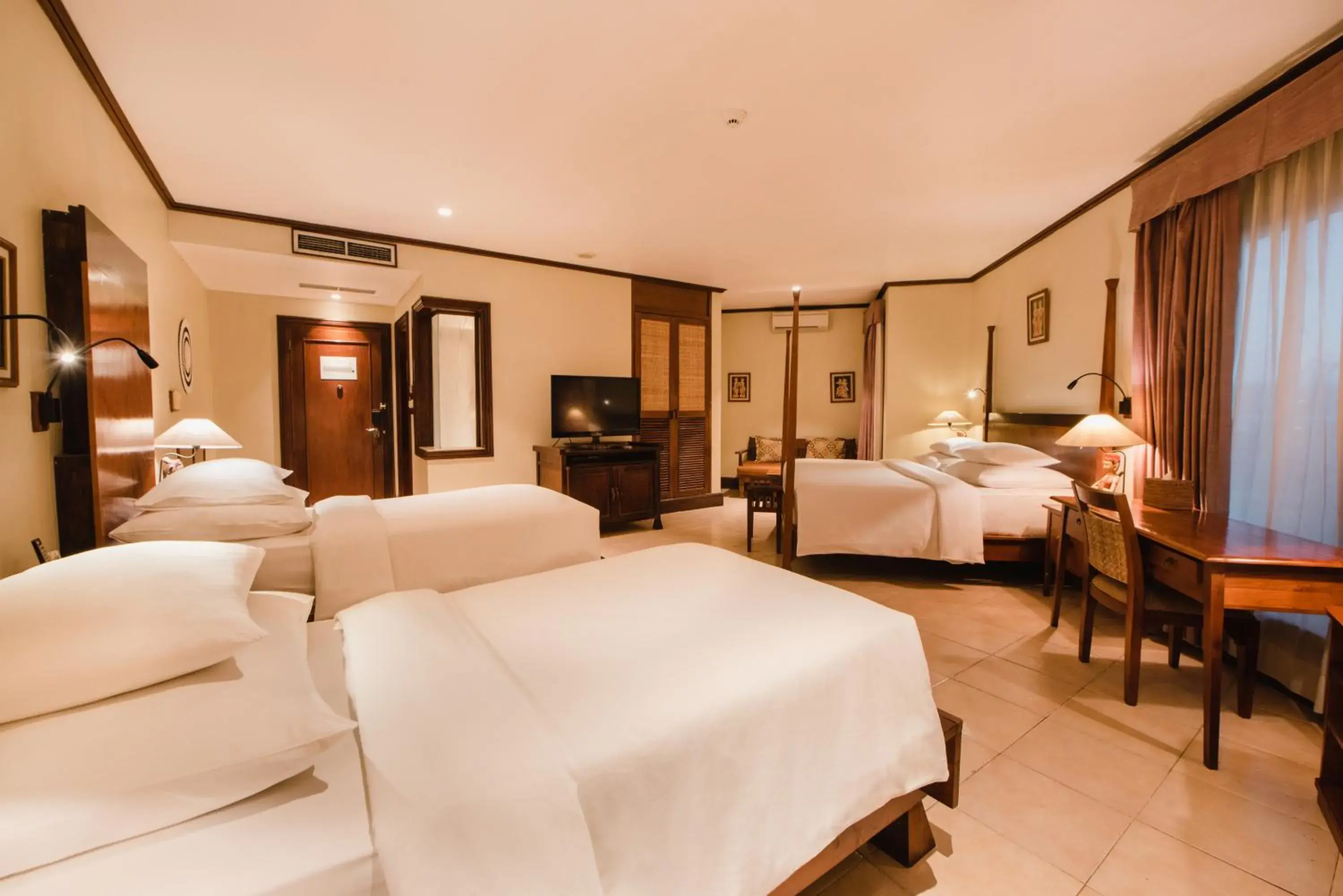 Bed in Ramayana Suites and Resort