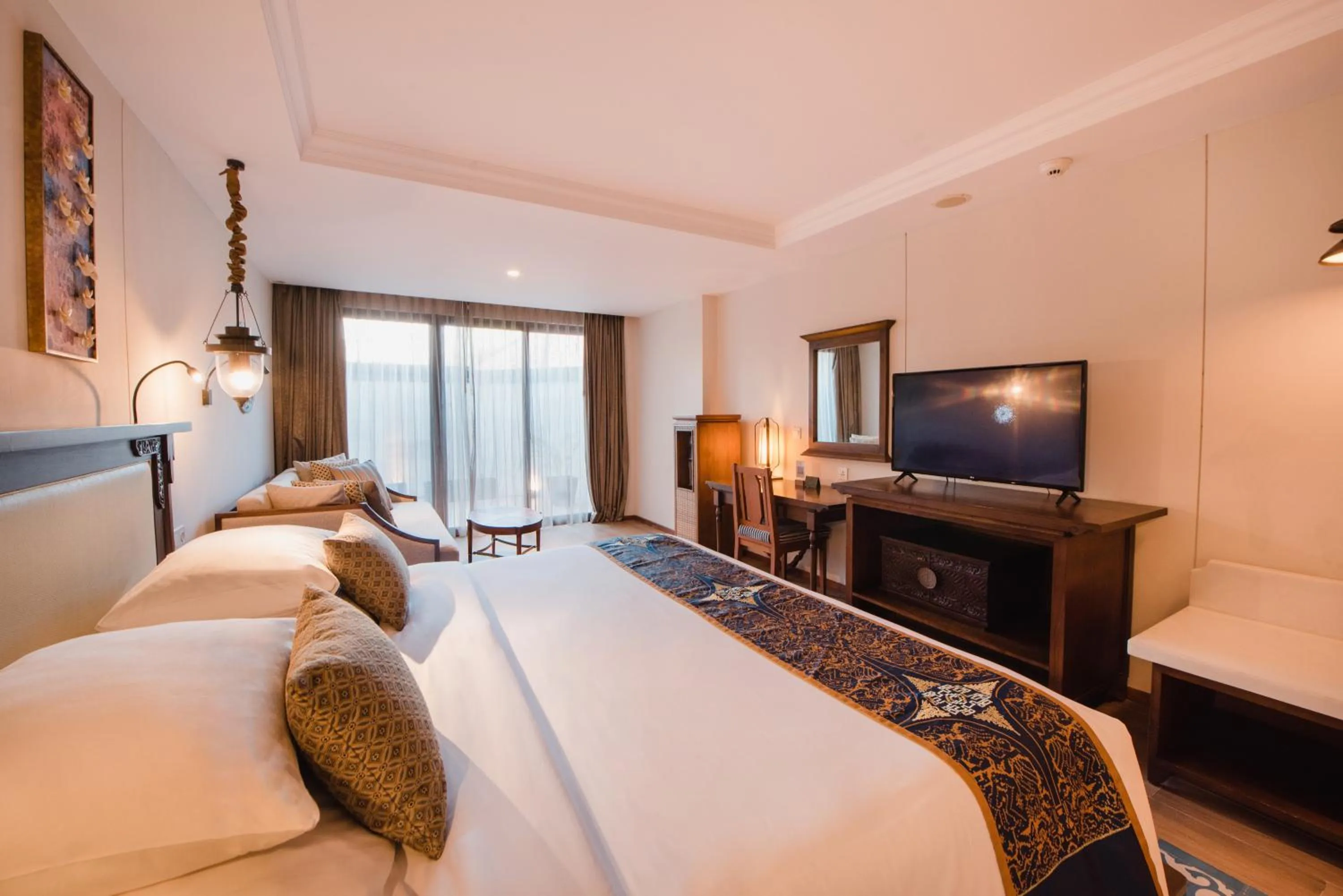 Bed in Ramayana Suites and Resort