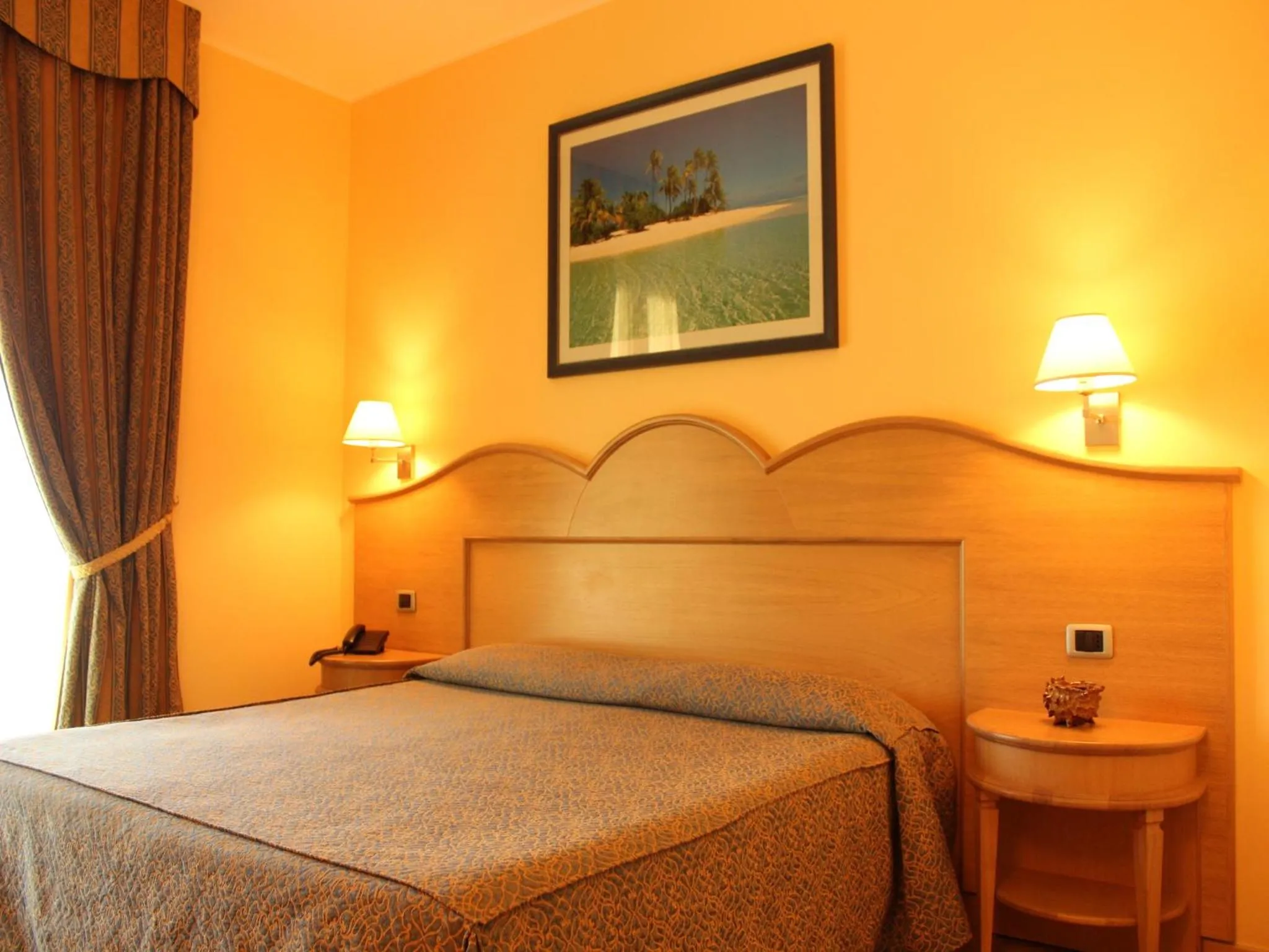 Bed in Blu Tropical Resort