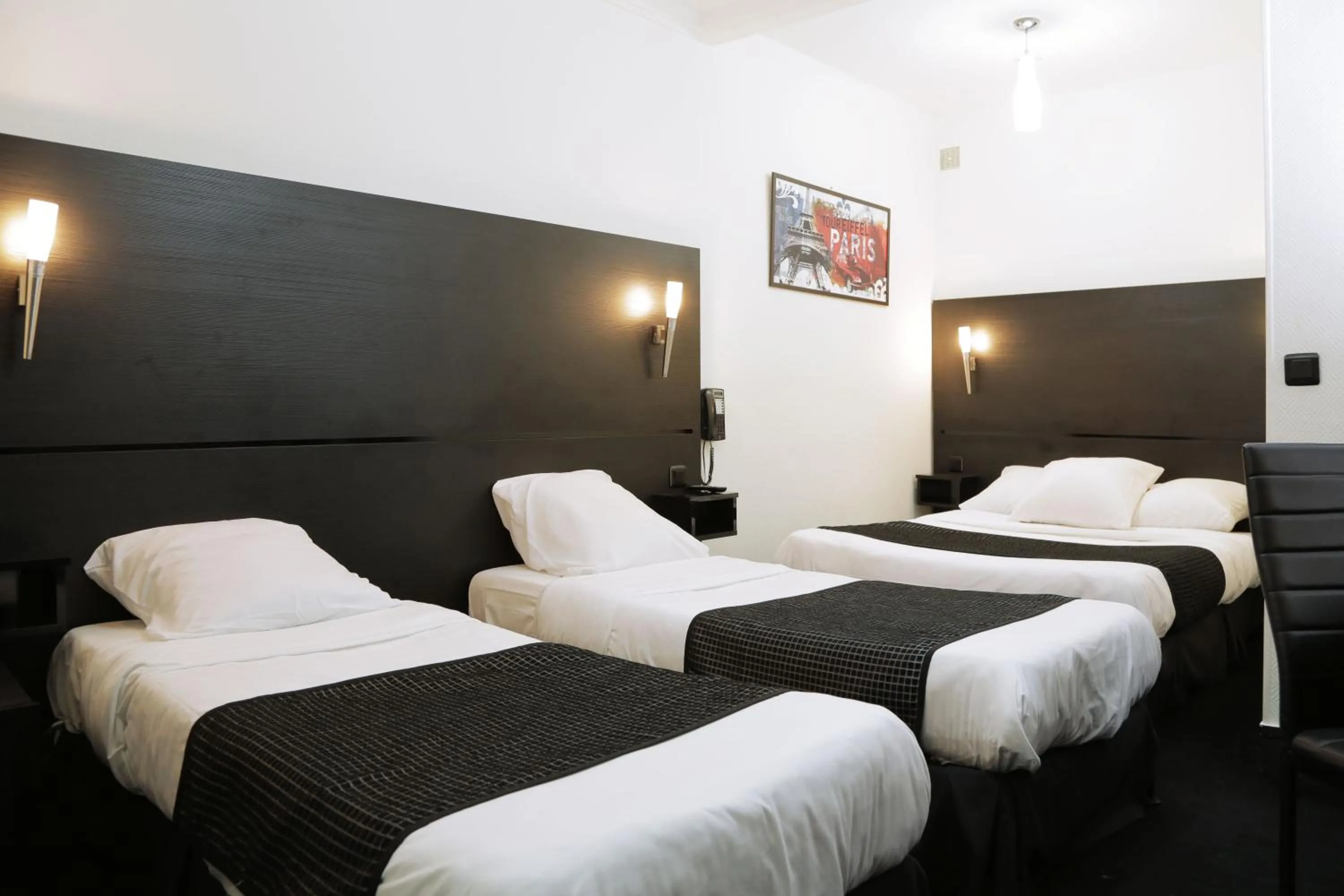 Photo of the whole room, Bed in Hôtel de l'Exposition - République