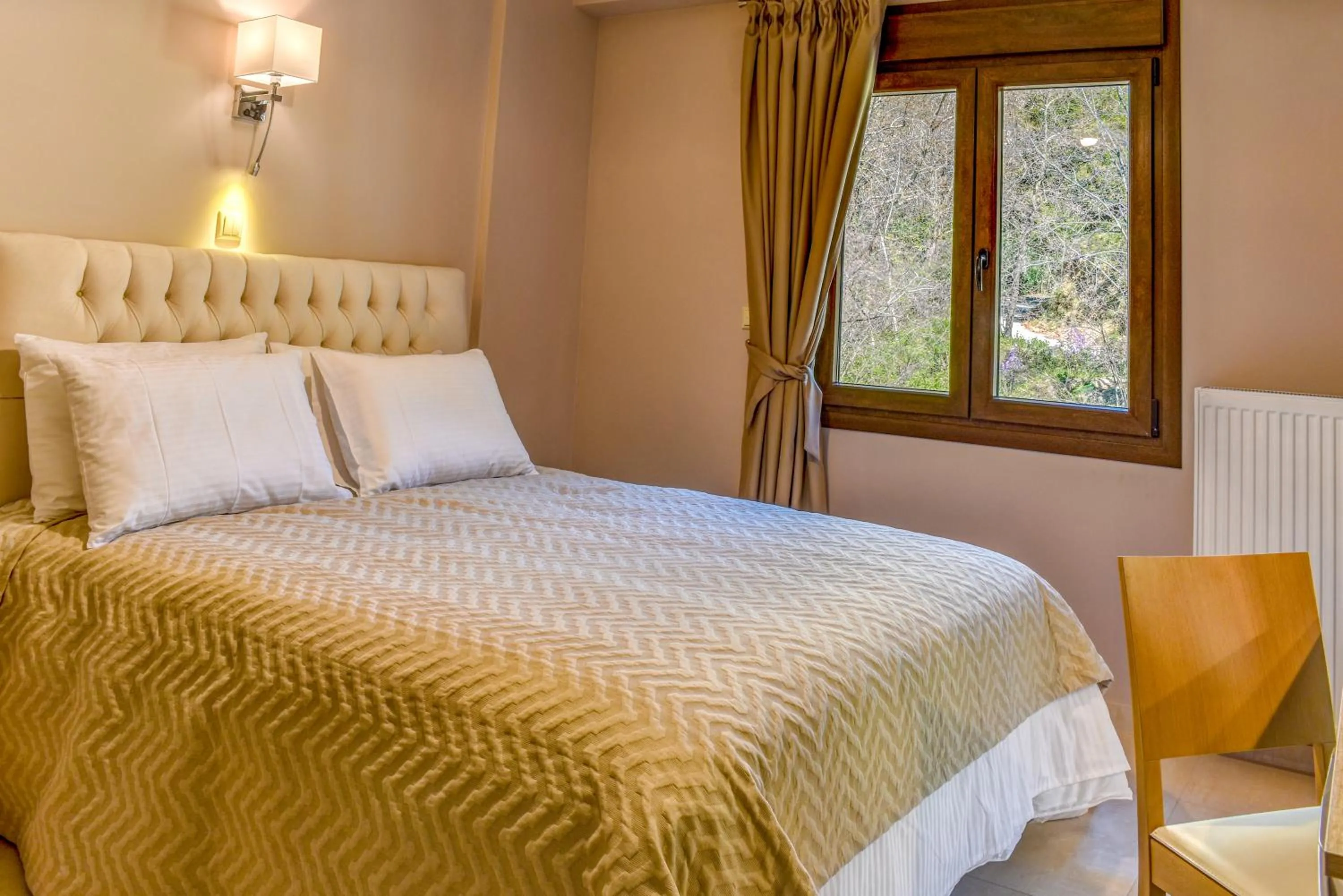 Bed in Elia Deluxe Accommodation