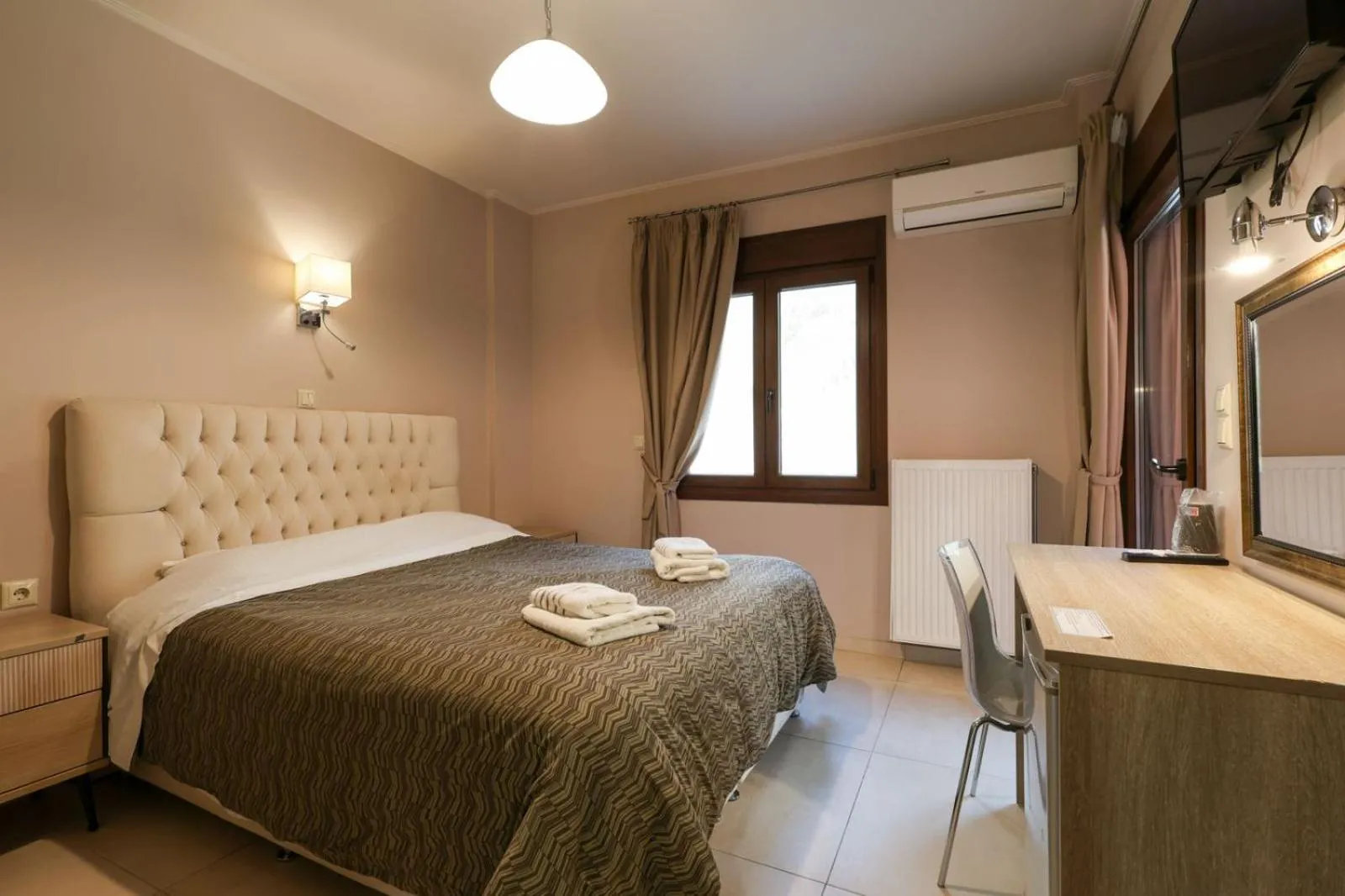 Bed in Elia Deluxe Accommodation