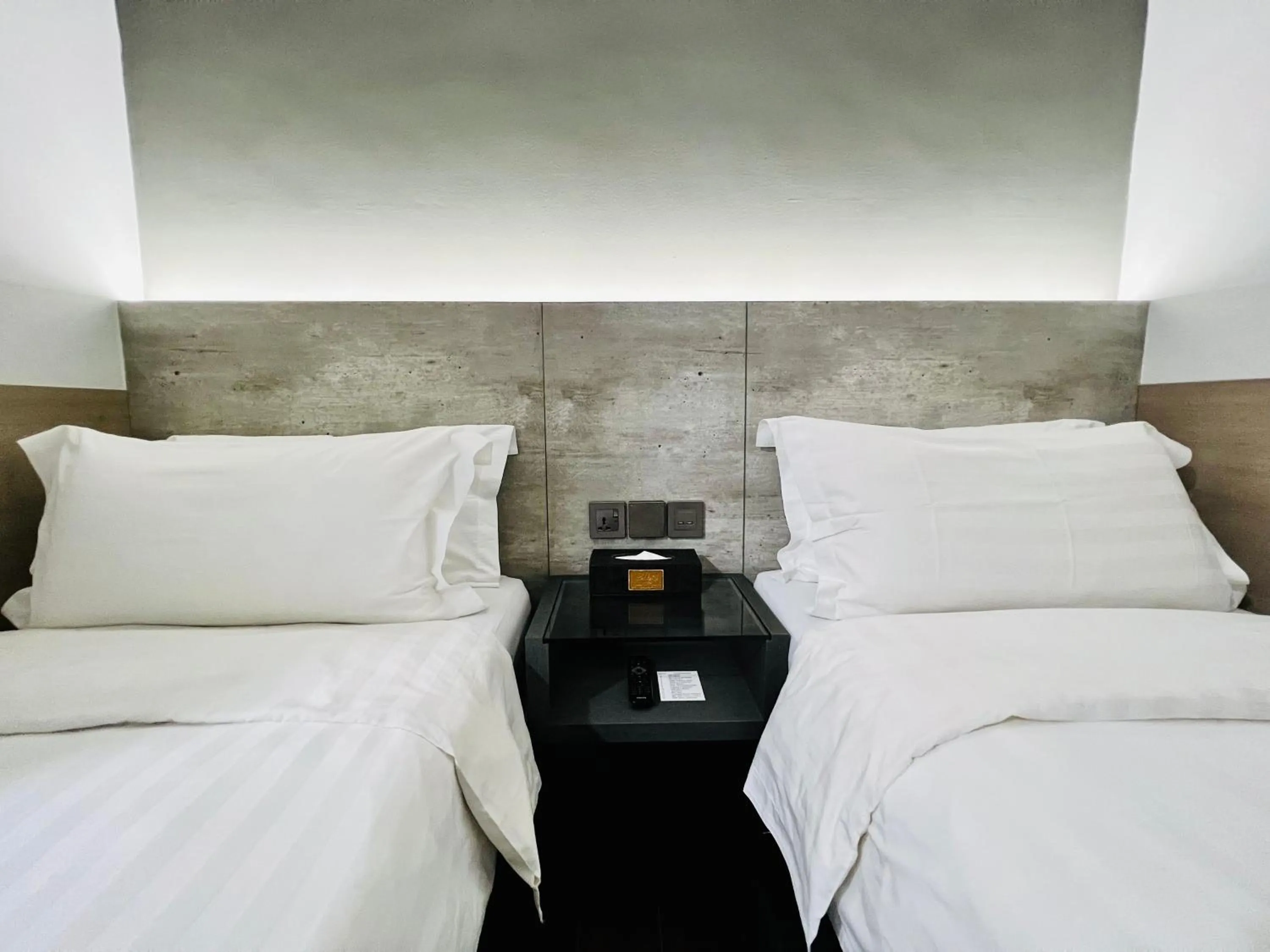 Bed in Bliss Hotel Singapore