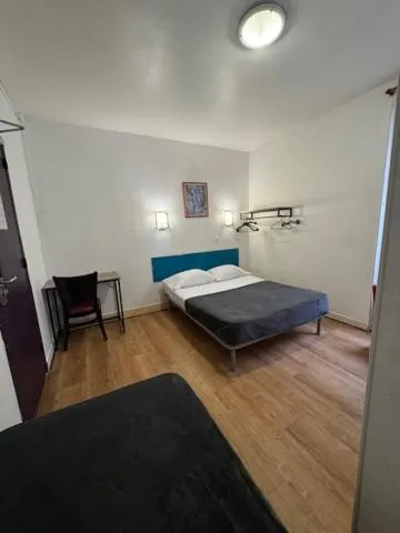 Bed in Hotel Chevallier