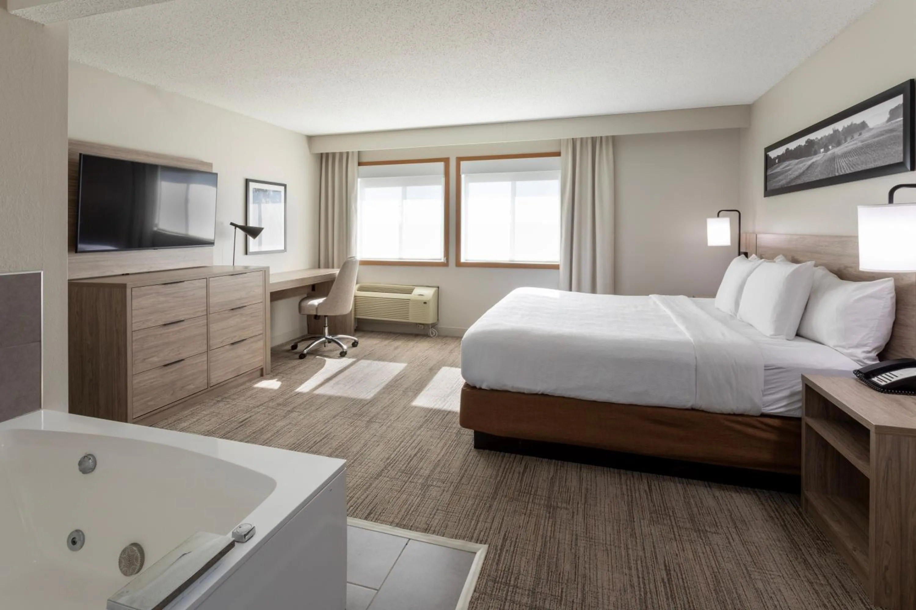 Bed in GrandStay Hotel & Suites