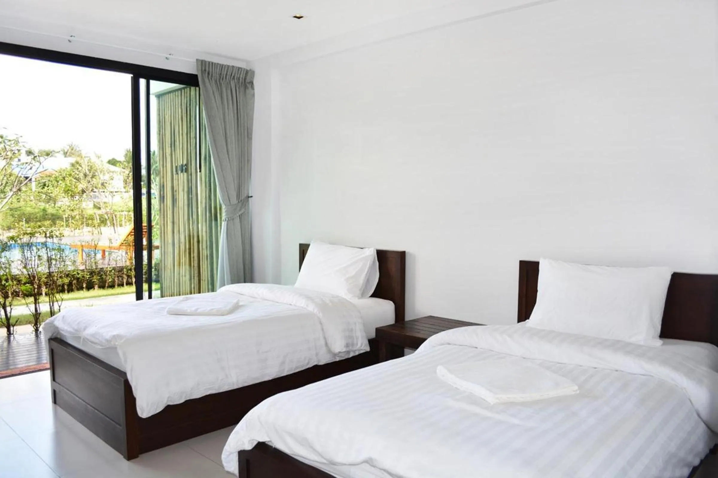 Bed in The Nidhra Boutique Resort