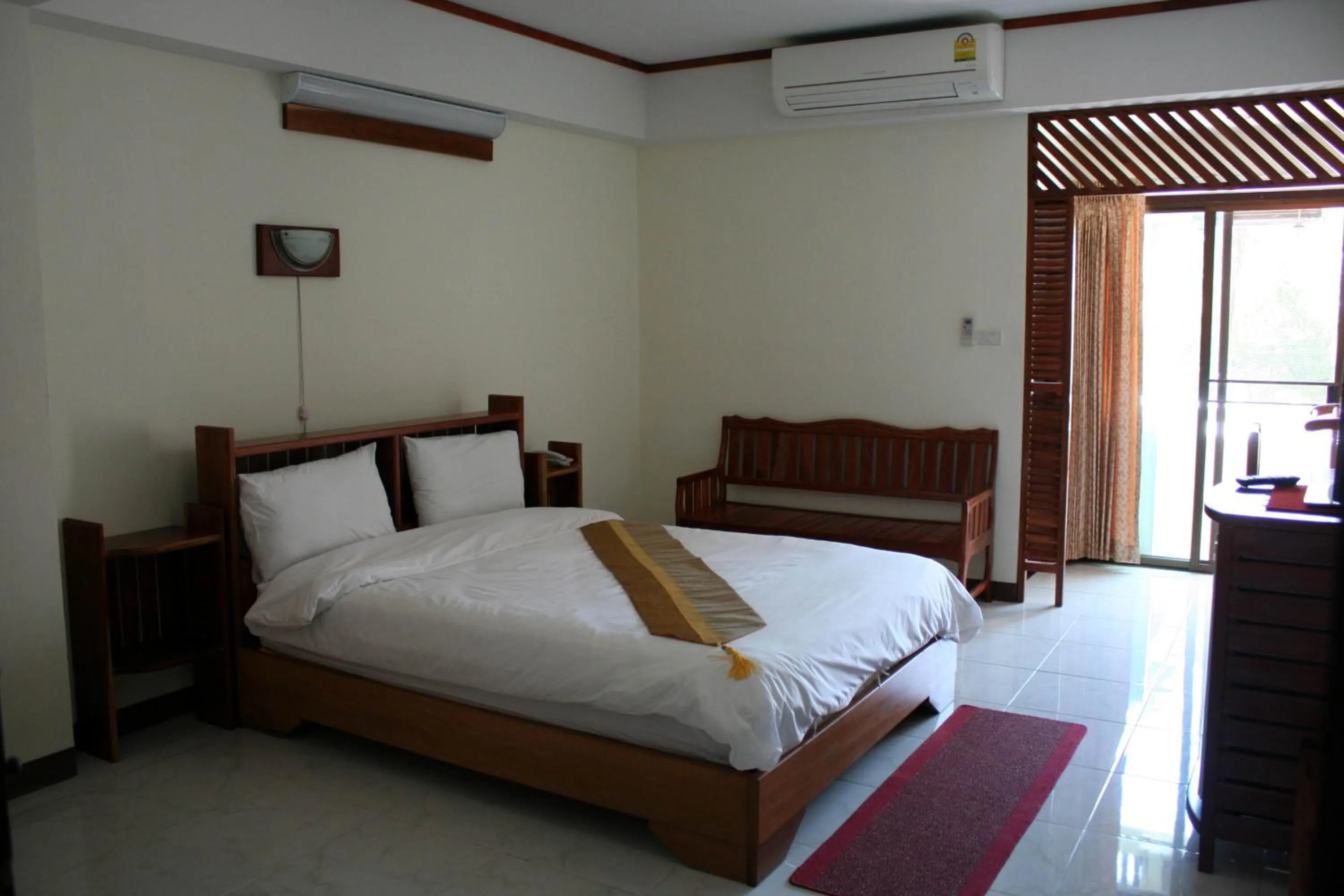 Bed in Riverfront Hotel Mukdahan