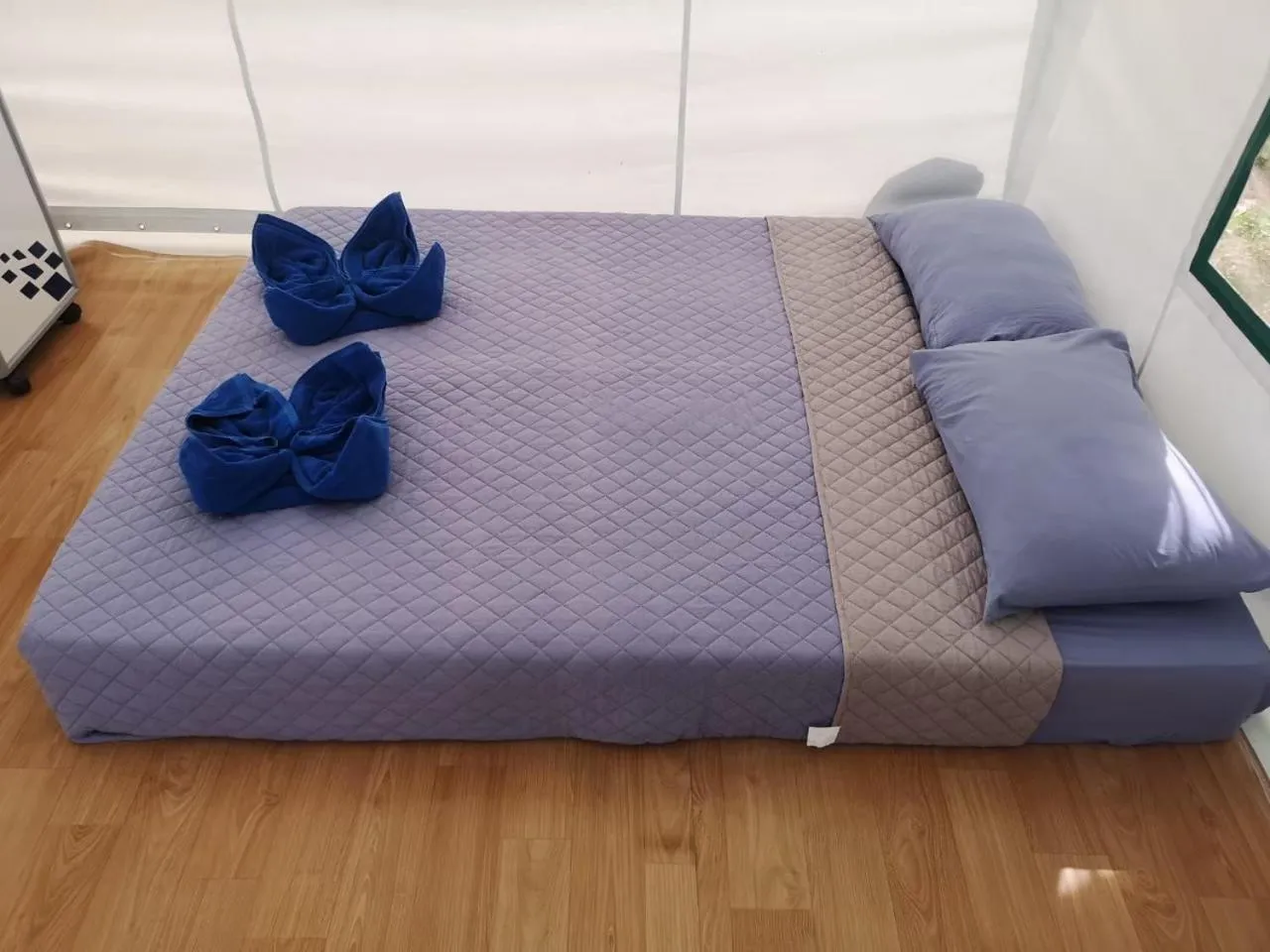 Bed in Buasawan Resort & Restaurant