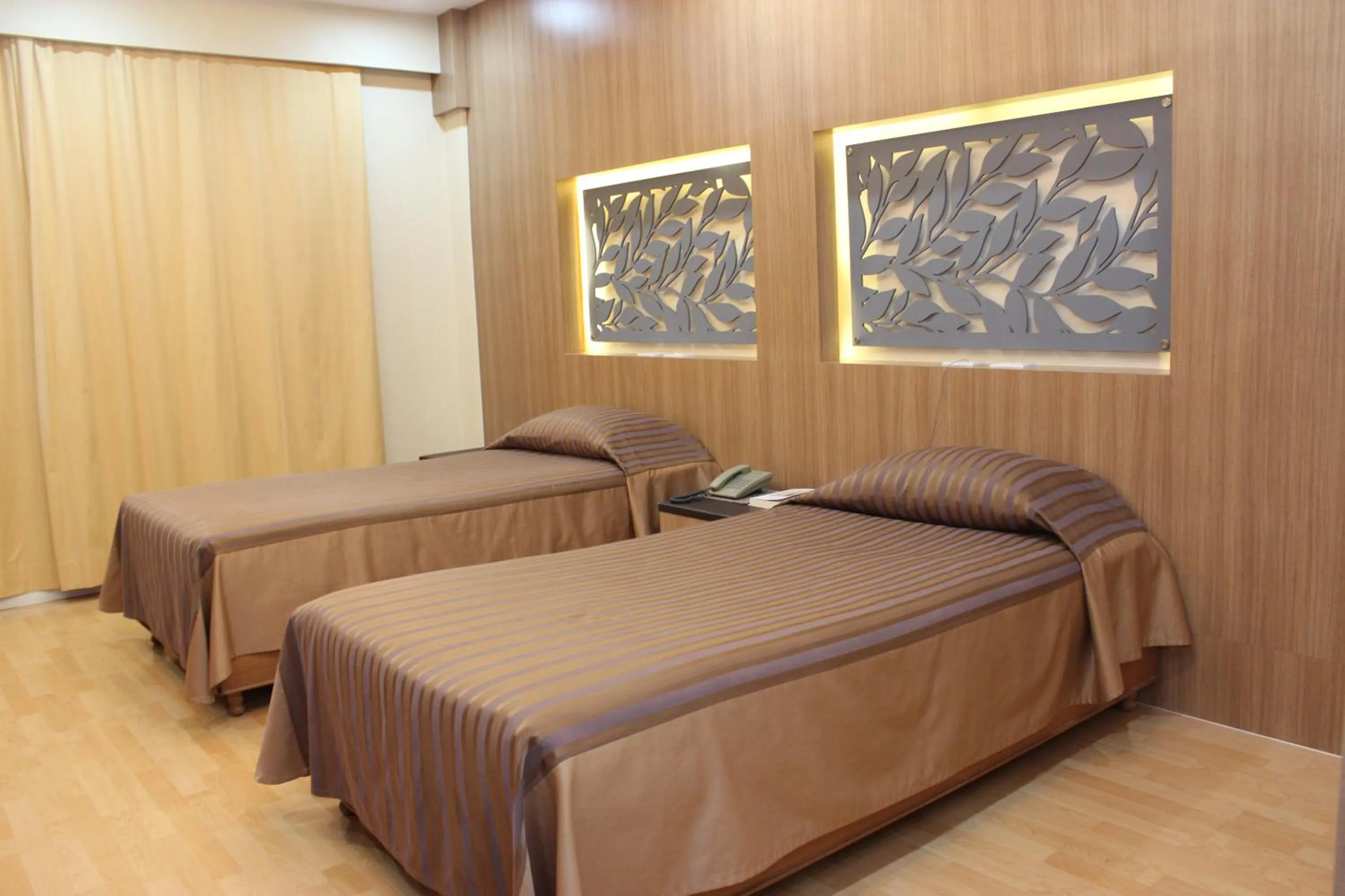 Bed in Charoen Hotel