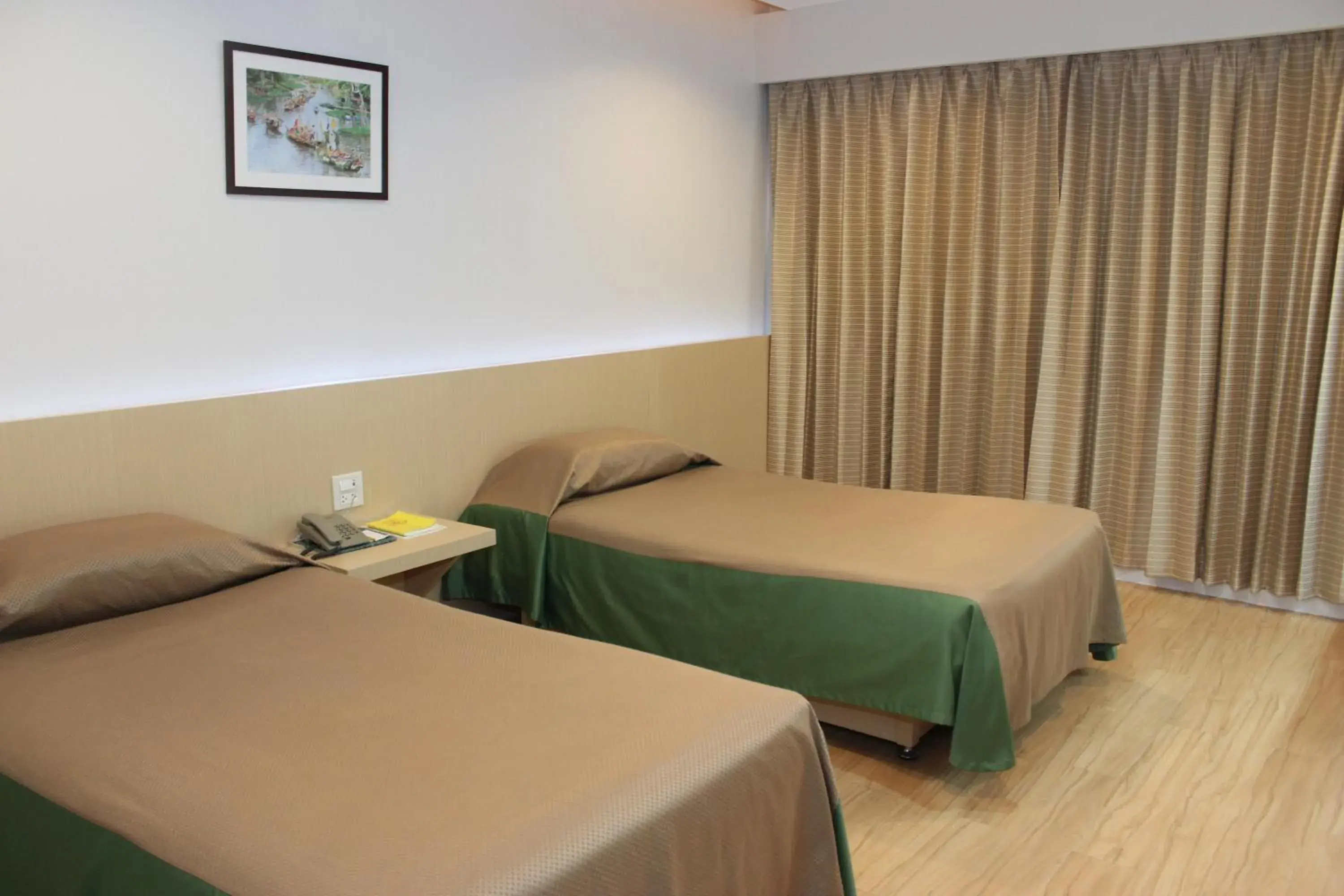 Bed in Charoen Hotel Bed in Charoen Hotel